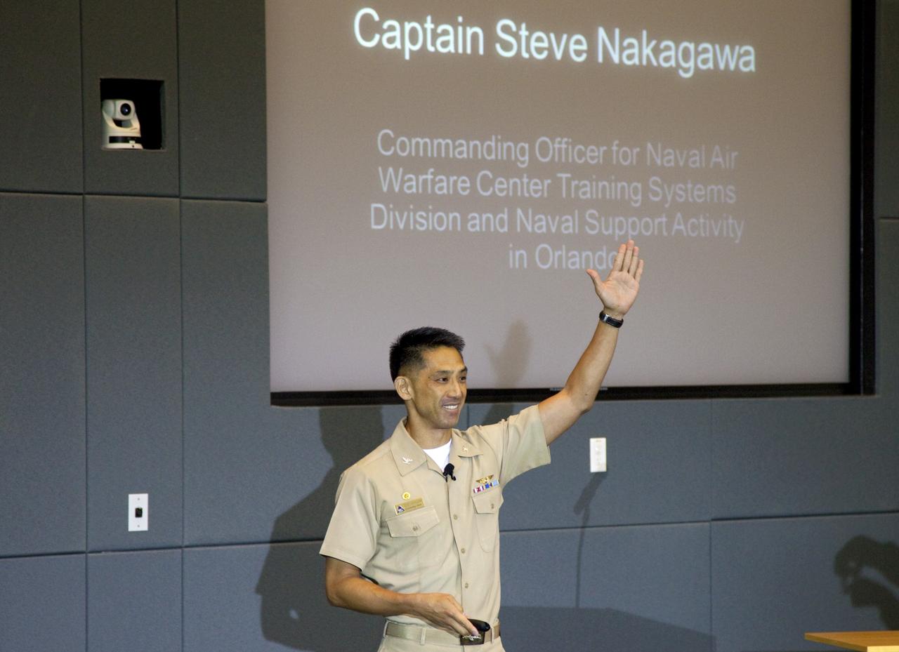 CAPE CANAVERAL, Fla. – Navy Capt. Steve Nakagawa, commanding officer for Naval Air Warfare Center Training Systems Division and Naval Support Activity, speaks during the Kennedy Space Center's Innovation Expo in the Operations Support Building II. The center-wide event gave researchers a chance to show some of their work to others and gave employees the opportunity to see facilities they hadn't viewed before. Photo credit: Gianni Woods