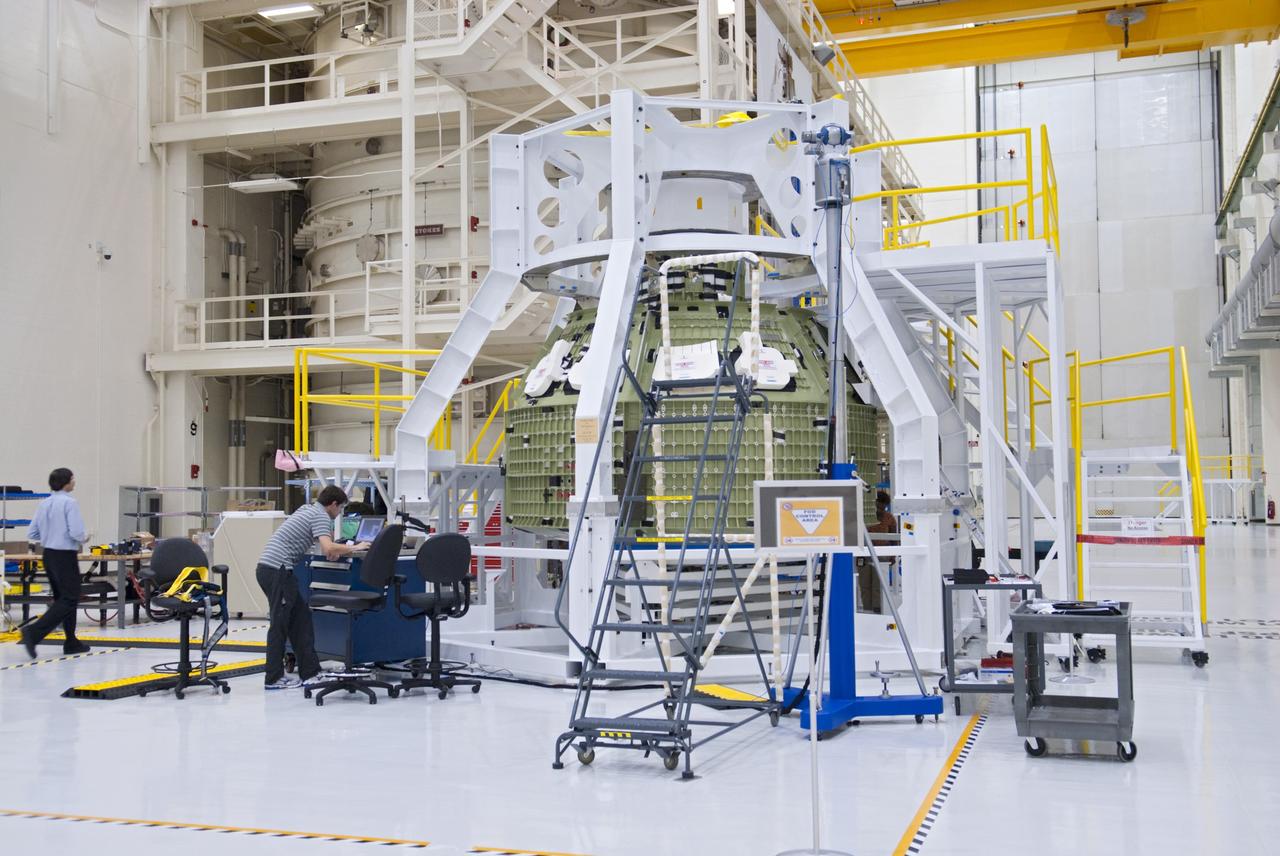 CAPE CANAVERAL, Fla. – Inside the Operations and Checkout Building at NASA’s Kennedy Space Center in Florida, a birdcage tool along with work platforms have been placed around the Orion Exploration Flight Test 1 crew module. The birdcage will be used to continue installation of external components in preparation for Orion’s first uncrewed test flight in 2014 atop a Delta IV rocket. Orion is the exploration spacecraft designed to carry crews to space beyond low Earth orbit. It will provide emergency abort capability, sustain the crew during the space travel and provide safe re-entry from deep space return velocities. A second uncrewed flight test is scheduled for 2017 on NASA’s Space Launch System rocket. For more information, visit http://www.nasa.gov/orion. Photo credit: NASA/Charisse Nahser