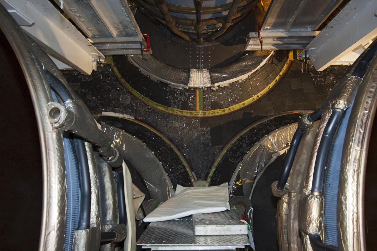 CAPE CANAVERAL, Fla. – On the aft end of space shuttle Atlantis, the insulation elements for the dome main engine heat shield are installed as the shuttle is prepared for public display following its retirement last year. Photo credit: NASA/Jim Grossmann