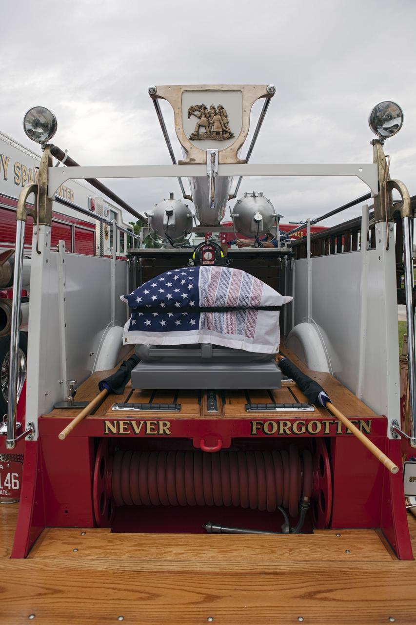 CAPE CANAVERAL, Fla. – A new 9/11 memorial was dedicated in front of Fire Station 1 at NASA’s Kennedy Space Center in Florida. Kennedy Fire and Rescue Services commemorated the 11th anniversary of 9/11 with a ceremony that included a minute of silence at 10:28 a.m., which was the moment of collapse of the north tower of the World Trade Center. Kennedy center-wide emergency units dispatched by Fire Control engaged in one-minute sirens, the new memorial was dedicated and the Honor Guard performed a flag-folding ceremony. Photo credit: NASA/Dimitri Gerondidakis