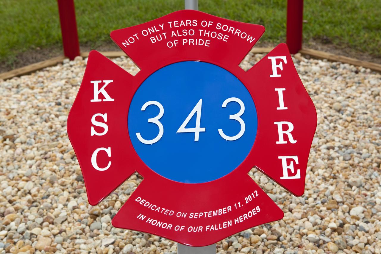 CAPE CANAVERAL, Fla. – At Fire Station 1 at NASA’s Kennedy Space Center in Florida, a new 9/11 memorial was dedicated during a ceremony held by Kennedy’s Fire and Rescue personnel.    Kennedy Fire and Rescue Services commemorated the 11th anniversary of 9/11 with a ceremony that included a minute of silence at 10:28 a.m., which was the moment of collapse of the north tower of the World Trade Center. Kennedy center-wide emergency units dispatched by Fire Control engaged in one-minute sirens, the new memorial was dedicated and the Honor Guard performed a flag-folding ceremony. Photo credit: NASA/Dimitri Gerondidakis