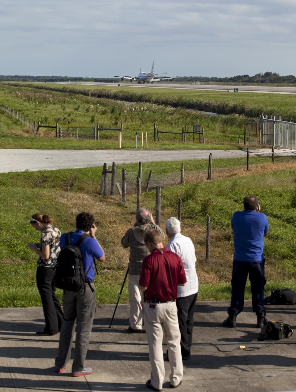 CAPE CANAVERAL, Fla. – Members of the media watch as the Shuttle Carrier Aircraft, or SCA, touched down at NASA Kennedy Space Center’s Shuttle Landing Facility in Florida at 5:05 p.m. EDT to prepare for shuttle Endeavour’s ferry flight to the Los Angeles International Airport on Sept. 17.    This SCA, designated NASA 905, is a modified Boeing 747 jet airliner, originally manufactured for commercial use. One of two SCAs employed over the course of the Space Shuttle Program, NASA 905 is assigned to the final ferry mission. Endeavour will be placed on permanent public display at the California Science Center in Los Angeles. For more information on the SCA, visit http://www.nasa.gov/centers/dryden/news/FactSheets/FS-013-DFRC.html. For more information on shuttle transition and retirement activities, visit http://www.nasa.gov/shuttle.  Photo credit: NASA/Frankie Martin