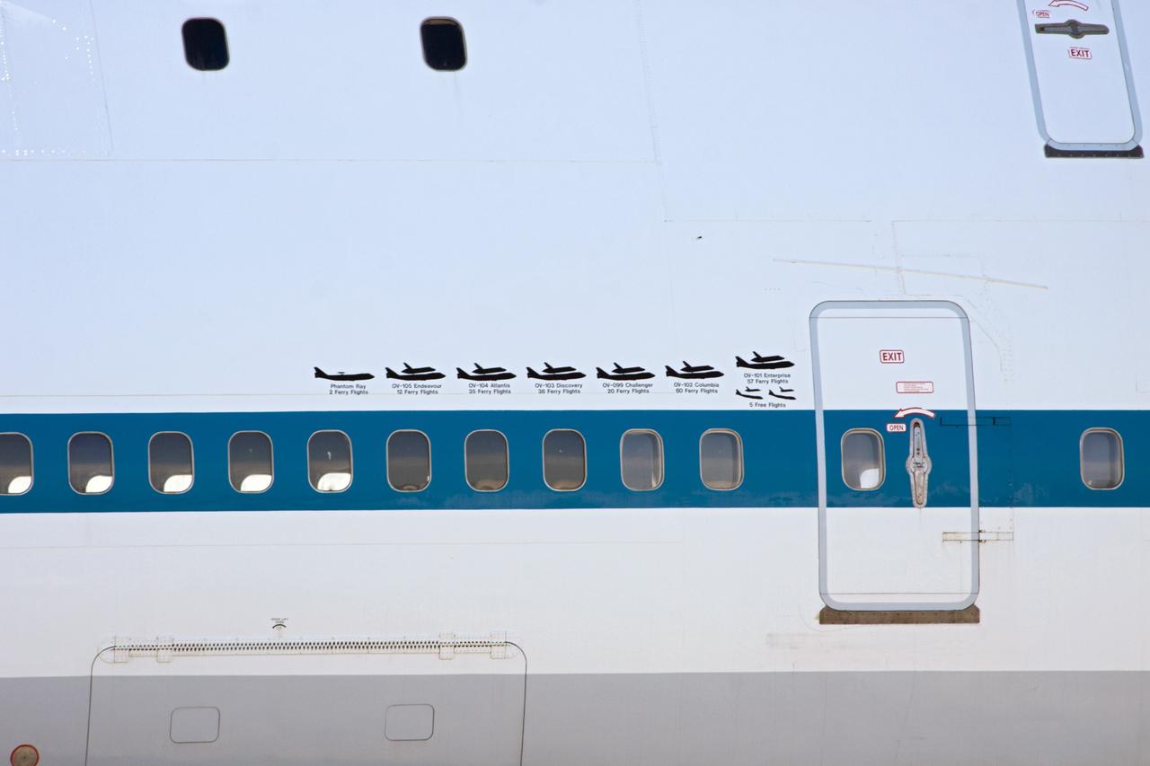CAPE CANAVERAL, Fla. – Detail of the mission insignia on the fuselage of the Shuttle Carrier Aircraft, or SCA, shortly after the aircraft parked at the ramp area at NASA Kennedy Space Center’s Shuttle Landing Facility in Florida. The SCA touched down at 5:05 p.m. EDT to prepare for shuttle Endeavour’s ferry flight to the Los Angeles International Airport on Sept. 17. Photo credit: NASA/ Jim Grossmann