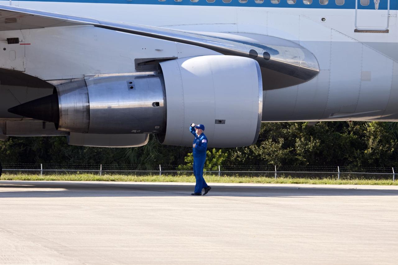 CAPE CANAVERAL, Fla. – A pilot looks over the Shuttle Carrier Aircraft, or SCA, after it parked on the ramp area at NASA Kennedy Space Center’s Shuttle Landing Facility in Florida. The SCA touched down at 5:05 p.m. EDT to prepare for shuttle Endeavour’s ferry flight to the Los Angeles International Airport on Sept. 17. Photo credit: NASA/Jim Grossmann