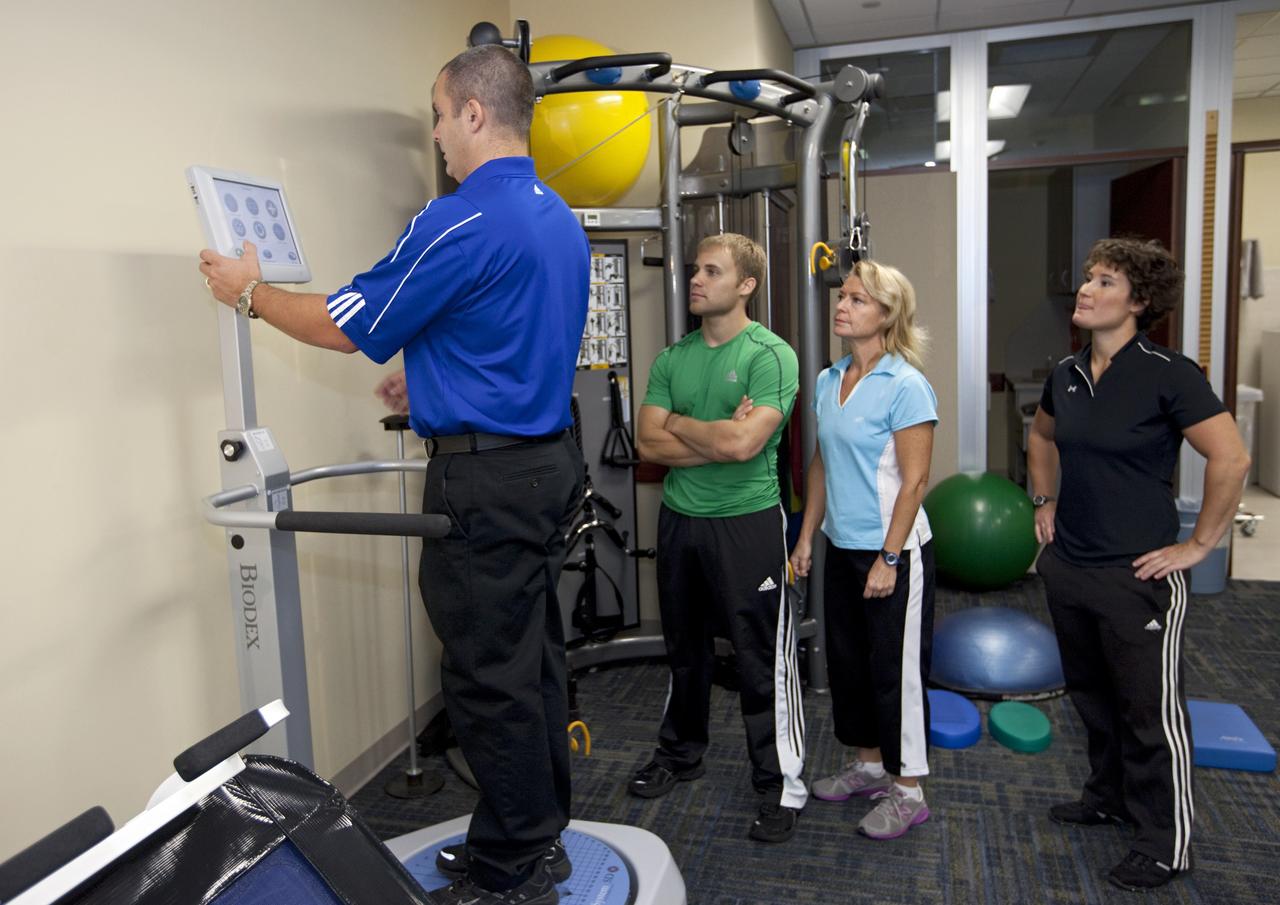 CAPE CANAVERAL, Fla. – At NASA’s Kennedy Space Center in Florida, workers view a new fitness machine in the RehabWorks facility in the Operations and Checkout building during the center’s 2012 Innovation Expo.    The center-wide event gave researchers a chance to show some of their work to others at the center and gave employees the opportunity to see facilities they hadn’t seen before. Photo credit: NASA/Kim Shiflett