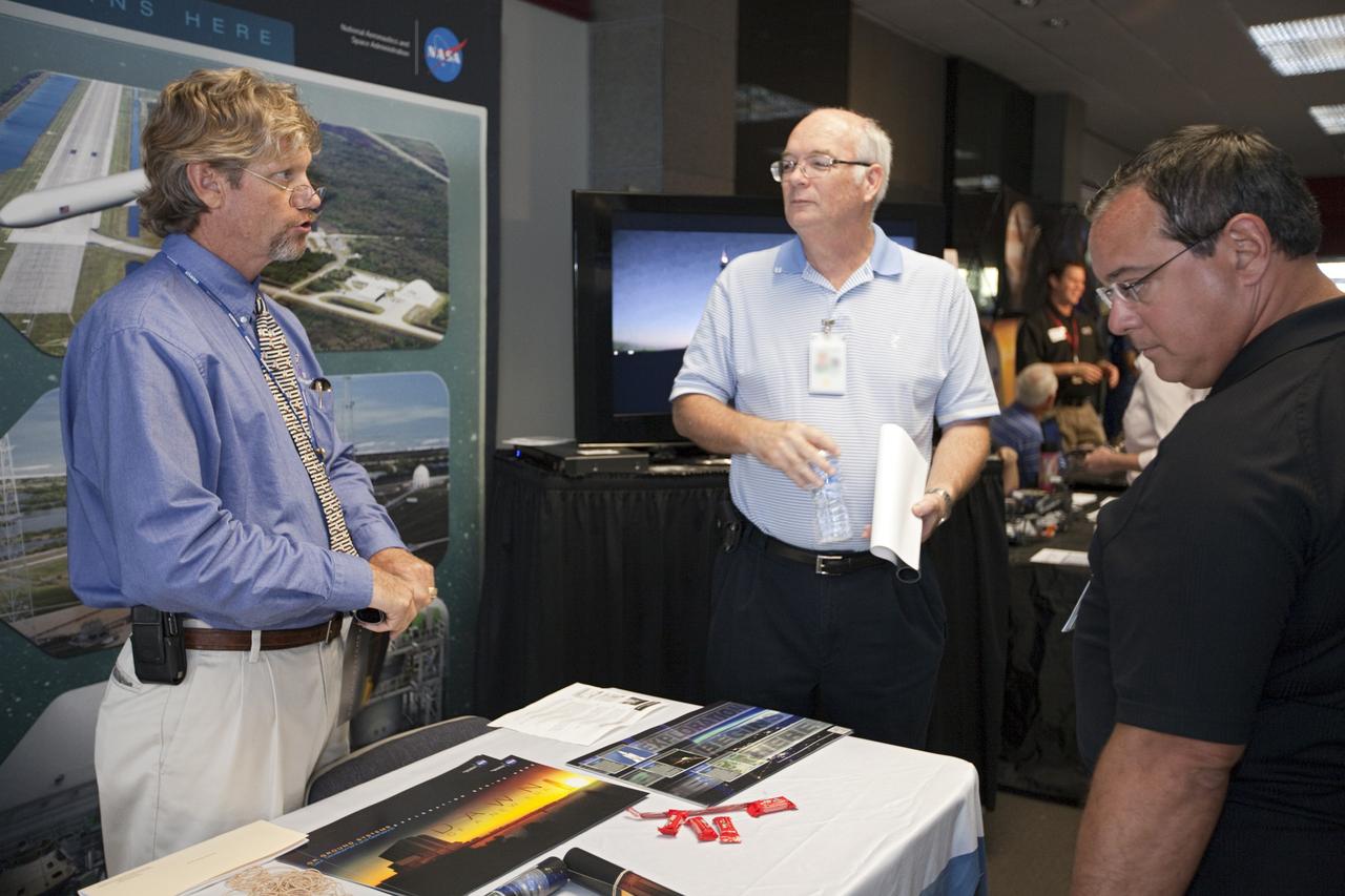 CAPE CANAVERAL, Fla. – At NASA’s Kennedy Space Center in Florida, workers learn about new innovations at the Ground Systems Development and Operations program exhibit in the Headquarters lobby during the center’s 2012 Innovation Expo.    The center-wide event gave researchers a chance to show some of their work to others at the center and gave employees the opportunity to see facilities they hadn’t seen before. Photo credit: NASA/Kim Shiflett