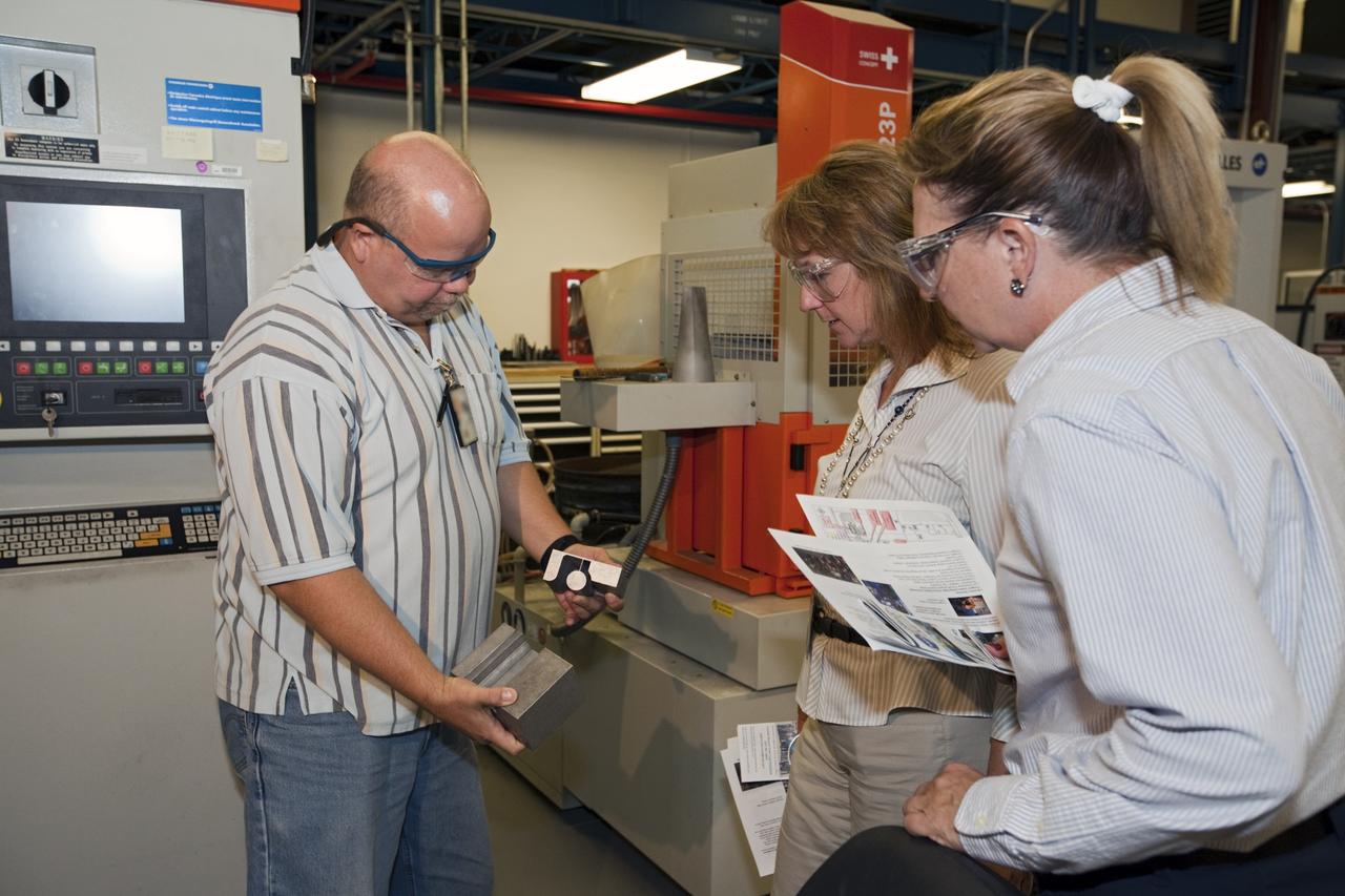 CAPE CANAVERAL, Fla. – At NASA’s Kennedy Space Center in Florida, workers learn how new technologies enable future development at the Prototype Shop during the center’s 2012 Innovation Expo.    The center-wide event gave researchers a chance to show some of their work to others at the center and gave employees the opportunity to see facilities they hadn’t seen before. Photo credit: NASA/Kim Shiflett