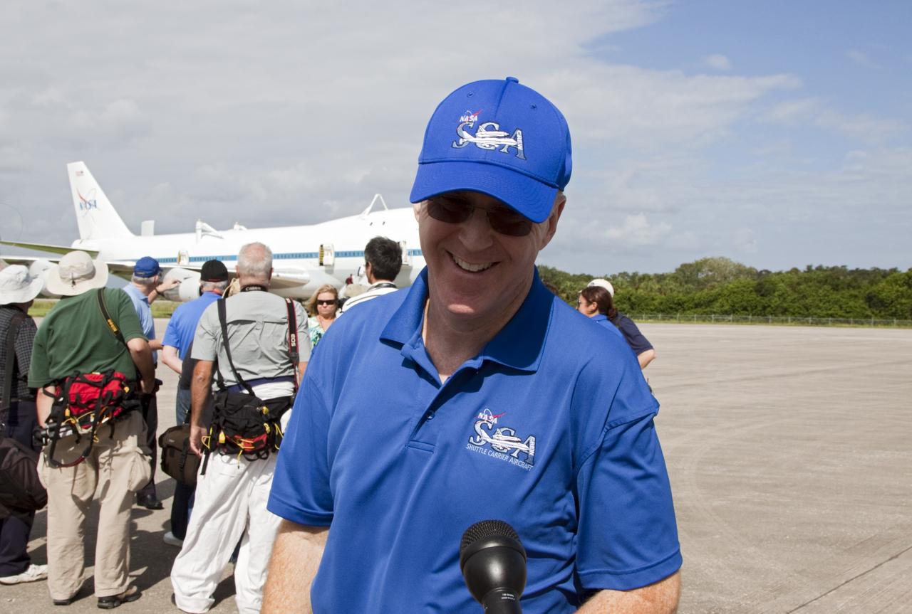 CAPE CANAVERAL, Fla. - Jeff Moultrie, pilot of the Shuttle Carrier Aircraft, or SCA, speaks with news media at the Shuttle Landing Facility at NASA's Kennedy Space Center in Florida. The SCA will take space shuttle Endeavour from Florida to Los Angeles for public display. Photo credit: NASA/Kim Shiflett