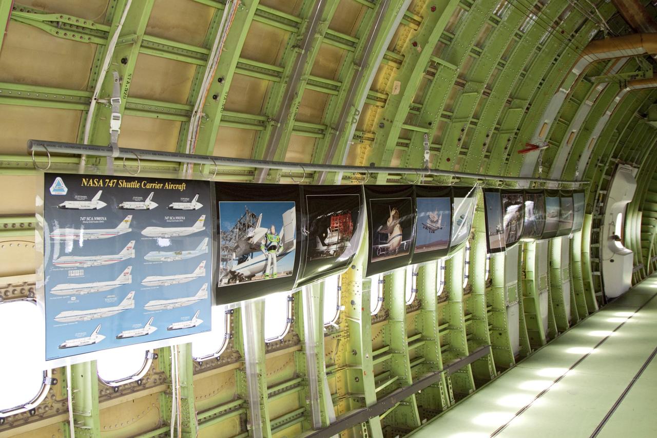 CAPE CANAVERAL, Fla. - A row of posters displays some of the history of the Shuttle Carrier Aircraft, or SCA, that will take space shuttle Endeavour from NASA's Kennedy Space Center in Florida to Los Angeles for public display. Photo credit: NASA/Kim Shiflett