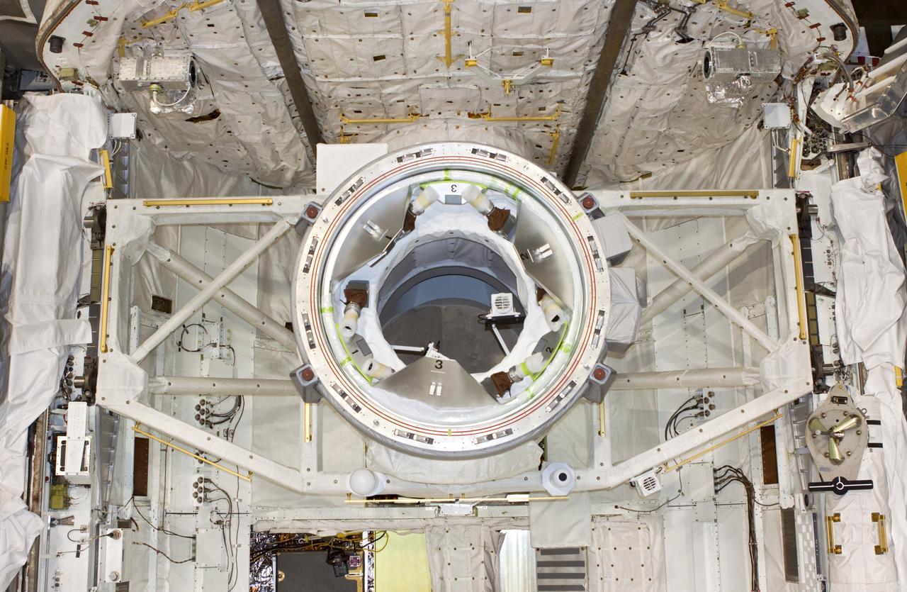 CAPE CANAVERAL, Fla. – In Bay 2 of the Orbiter Processing Facility at NASA's Kennedy Space Center in Florida, a mock air lock, seen in this overhead view, has been installed in the payload bay of the space shuttle Atlantis. The orbiter is undergoing final preparations for its transfer to the Kennedy Space Center Visitor Complex targeted for November.      The work is part of Transition and Retirement of the remaining space shuttles, Atlantis and Endeavour. Atlantis is being prepared for public display at Kennedy's Visitor Complex. Over the course of its 26-year career, Atlantis spent 293 days in space during 33 missions. For more information, visit http://www.nasa.gov/transition Photo credit: NASA/Jim Grossmann