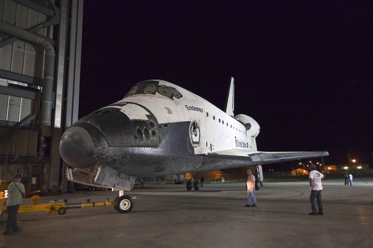 CAPE CANAVERAL, Fla. – Space shuttle Endeavour is moved out of the Vehicle Assembly Building on its way to the Mate-Demate Device, or MDD, at NASA's Kennedy Space Center in Florida. The MDD is located at the Shuttle Landing Facility at Kennedy. The shuttle will be lifted and connected to the top of NASA's Shuttle Carrier Aircraft SCA, a modified 747 jetliner. The shuttle has been fitted with an aerodynamic tailcone for its flight aboard the SCA to Los Angeles where it will be placed on public display. Photo credit: NASA/Kim Shiflett
