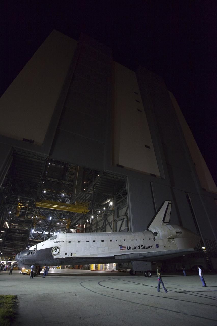 CAPE CANAVERAL, Fla. – Space shuttle Endeavour is moved out of the Vehicle Assembly Building on its way to the Mate-Demate Device, or MDD, at NASA's Kennedy Space Center in Florida. The MDD is located at the Shuttle Landing Facility at Kennedy. The shuttle will be lifted and connected to the top of NASA's Shuttle Carrier Aircraft SCA, a modified 747 jetliner. The shuttle has been fitted with an aerodynamic tailcone for its flight aboard the shuttle carrier aircraft to Los Angeles where it will be placed on public display. Photo credit: NASA/Kim Shiflett
