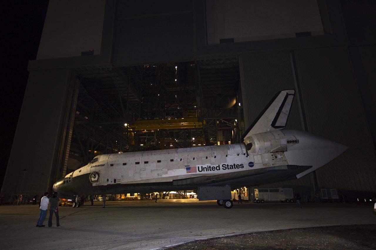 CAPE CANAVERAL, Fla. – Space shuttle Endeavour is moved out of the Vehicle Assembly Building on its way to the Mate-Demate Device, or MDD, at NASA's Kennedy Space Center in Florida. The MDD is located at the Shuttle Landing Facility at Kennedy. The shuttle will be lifted and connected to the top of NASA's Shuttle Carrier Aircraft SCA, a modified 747 jetliner. The shuttle has been fitted with an aerodynamic tailcone for its flight aboard the SCA to Los Angeles where it will be placed on public display. Photo credit: NASA/Kim Shiflett