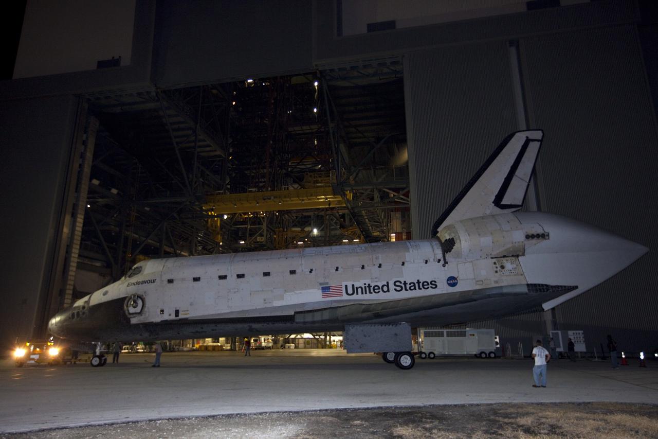 CAPE CANAVERAL, Fla. – Space shuttle Endeavour is moved out of the Vehicle Assembly Building on its way to the Mate-Demate Device, or MDD, at NASA's Kennedy Space Center in Florida. The MDD is located at the Shuttle Landing Facility at Kennedy. The shuttle will be lifted and connected to the top of NASA's Shuttle Carrier Aircraft SCA, a modified 747 jetliner. The shuttle has been fitted with an aerodynamic tailcone for its flight aboard the SCA to Los Angeles where it will be placed on public display. Photo credit: NASA/Kim Shiflett
