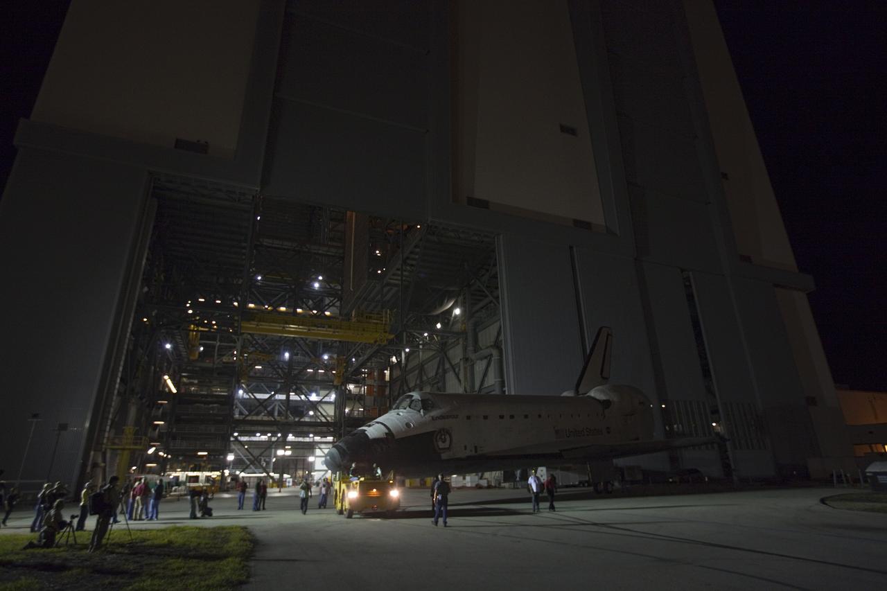 CAPE CANAVERAL, Fla. – Space shuttle Endeavour is towed to the Mate-Demate Device, or MDD, at NASA's Kennedy Space Center in Florida after being backed out of the Vehicle Assembly Building. The MDD is located at the Shuttle Landing Facility at Kennedy. The shuttle will be lifted and connected to the top of NASA's Shuttle Carrier Aircraft SCA, a modified 747 jetliner. The shuttle has been fitted with an aerodynamic tailcone for its flight aboard the SCA to Los Angeles where it will be placed on public display. Photo credit: NASA/Kim Shiflett