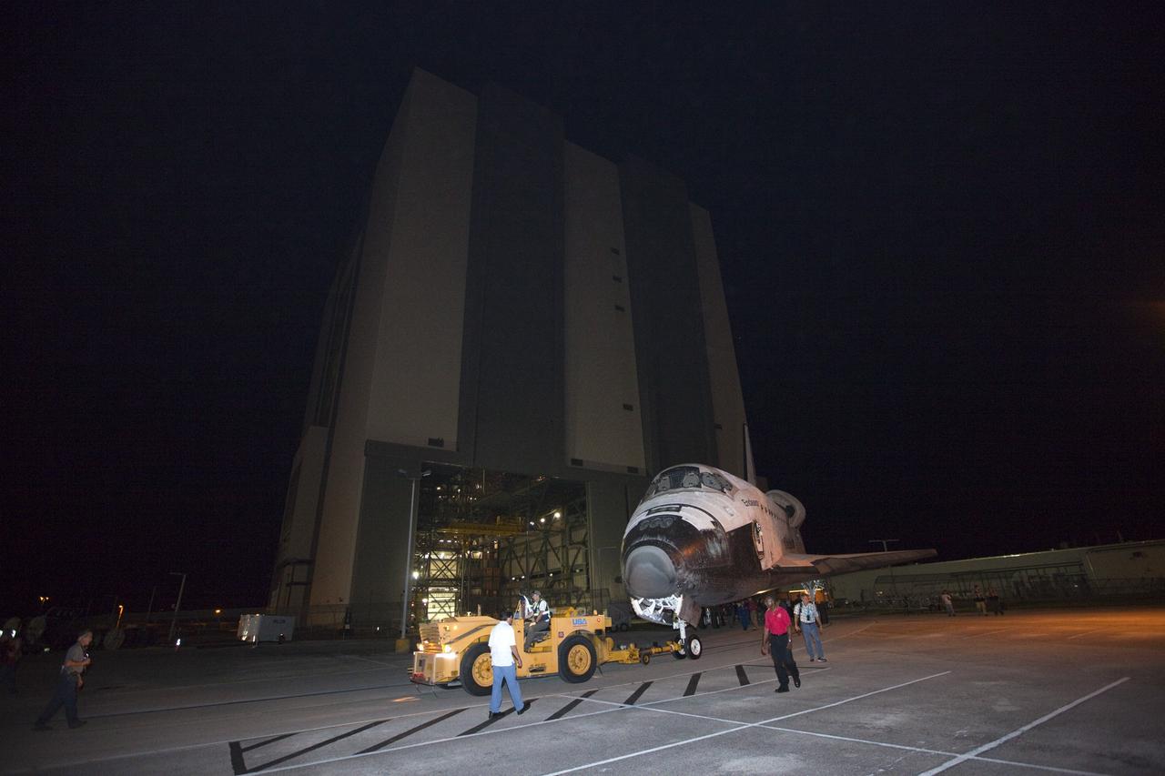 CAPE CANAVERAL, Fla. – Space shuttle Endeavour is towed away from the open doors of the Vehicle Assembly Building at NASA's Kennedy Space Center in Florida. The spacecraft moved to the nearby Shuttle Landing Facility, where it will be lifted in the gantry-like Mate-Demate Device and placed atop NASA's modified 747 Shuttle Carrier Aircraft for the final ferry flight of the Space Shuttle Program. Endeavour will be placed on permanent public display at the California Science Center in Los Angeles. Photo credit: NASA/Kim Shiflett