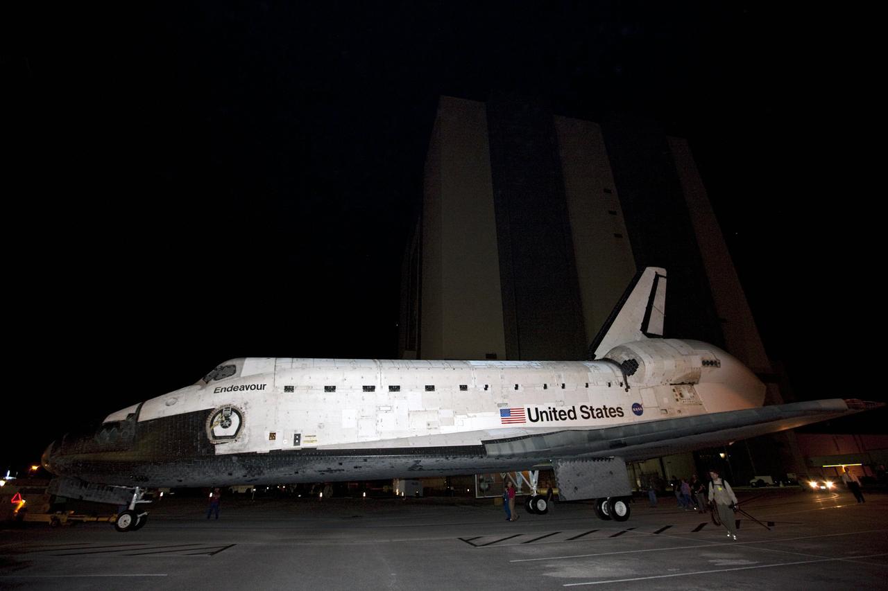 CAPE CANAVERAL, Fla. – In the early morning darkness at NASA's Kennedy Space Center in Florida, space shuttle Endeavour is towed away from the Vehicle Assembly Building, beginning the short move to the nearby Shuttle Landing Facility. The spacecraft will be lifted in the gantry-like Mate-Demate Device and placed atop NASA's modified 747 Shuttle Carrier Aircraft for the final ferry flight of the Space Shuttle Program. Endeavour will be placed on permanent public display at the California Science Center in Los Angeles. Photo credit: NASA/Kim Shiflett