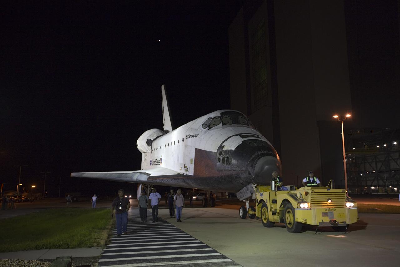 CAPE CANAVERAL, Fla. – Space shuttle Endeavour is towed away from the Vehicle Assembly Building, beginning the short move to the nearby Shuttle Landing Facility. The spacecraft will be lifted in the gantry-like Mate-Demate Device and placed atop NASA's modified 747 Shuttle Carrier Aircraft for the final ferry flight of the Space Shuttle Program. Endeavour will be placed on permanent public display at the California Science Center in Los Angeles. Photo credit: NASA/Kim Shiflett