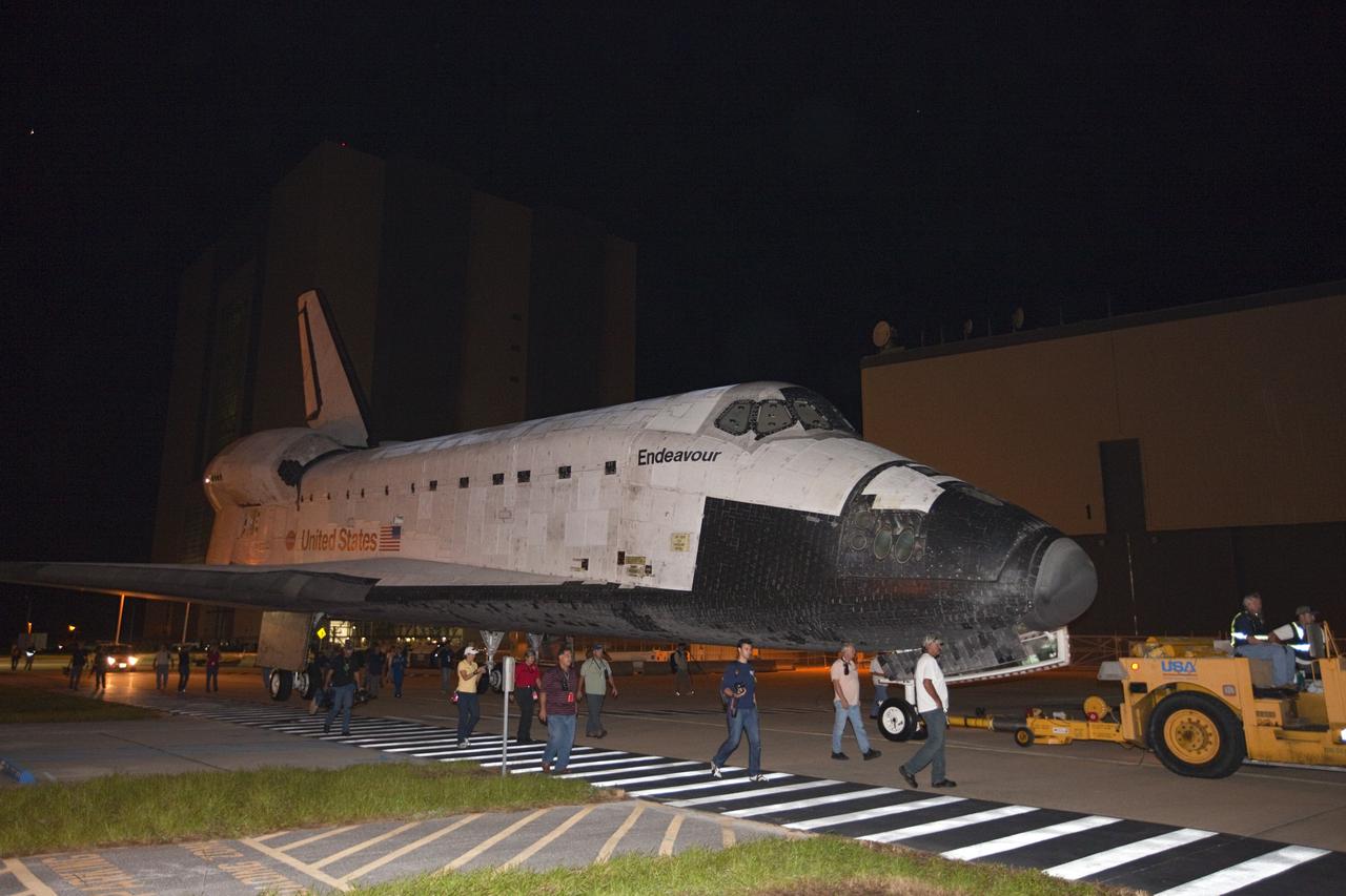 CAPE CANAVERAL, Fla. – At NASA's Kennedy Space Center in Florida, space shuttle Endeavour rolls past Orbiter Processing Facilty-1 on its way from the Vehicle Assembly Building to the nearby Shuttle Landing Facility. The spacecraft will be lifted in the gantry-like Mate-Demate Device and placed atop NASA's modified 747 Shuttle Carrier Aircraft for the final ferry flight of the Space Shuttle Program. Endeavour will be placed on permanent public display at the California Science Center in Los Angeles. Photo credit: NASA/Kim Shiflett