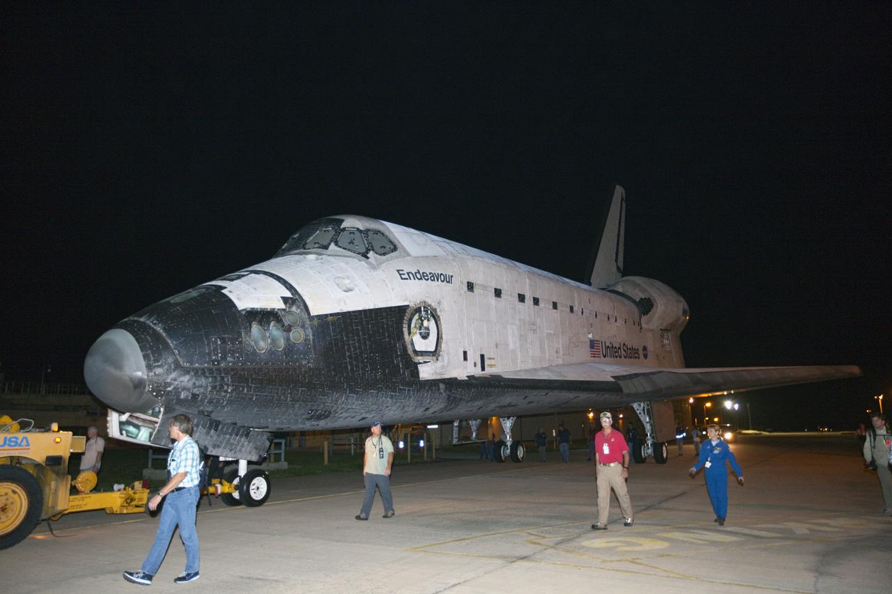 CAPE CANAVERAL, Fla. – Space shuttle Endeavour is brightly lit as it rolls through the early morning darkness at NASA's Kennedy Space Center in Florida. The spacecraft was in the process of moving from the Vehicle Assembly Building at NASA's Kennedy Space Center in Florida to the nearby Shuttle Landing Facility, where it will be lifted in the gantry-like Mate-Demate Device and placed atop NASA's modified 747 Shuttle Carrier Aircraft for the final ferry flight of the Space Shuttle Program. Endeavour will be placed on permanent public display at the California Science Center in Los Angeles. Photo credit: NASA/Kim Shiflett