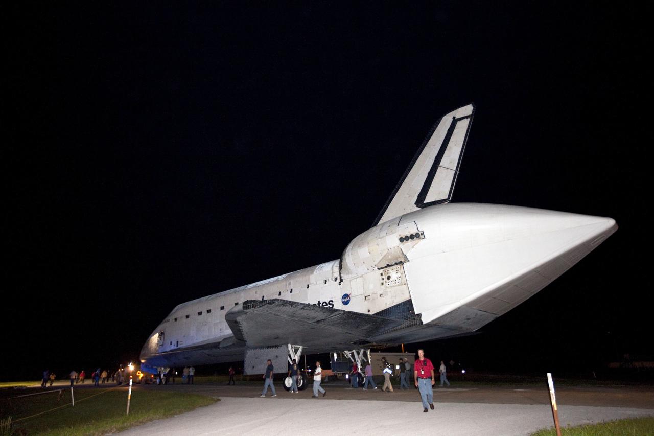 CAPE CANAVERAL, Fla. – Space shuttle Endeavour, fitted with an aerodynamic tail cone, leaves the processing facilities of Launch Complex 39 behind as it moves toward the Shuttle Landing Facility at NASA's Kennedy Space Center in Florida. The spacecraft will be lifted in the gantry-like Mate-Demate Device and placed atop NASA's modified 747 Shuttle Carrier Aircraft for the final ferry flight of the Space Shuttle Program. Endeavour will be placed on permanent public display at the California Science Center in Los Angeles. Photo credit: NASA/Kim Shiflett