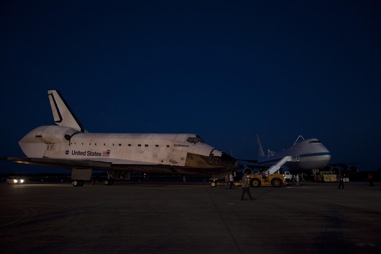 CAPE CANAVERAL, Fla. – Space shuttle Endeavour arrives at the Shuttle Landing Facility after the shuttle was towed from the Vehicle Assembly Building at NASA's Kennedy Space Center in Florida. Endeavour was towed to the Mate-Demate Device, or MDD, where the shuttle will be lifted and connected to the top of NASA's Shuttle Carrier Aircraft SCA, a modified 747 jetliner. The shuttle has been fitted with an aerodynamic tailcone for its flight aboard the SCA to Los Angeles where it will be placed on public display. Photo credit: NASA/Kim Shiflett
