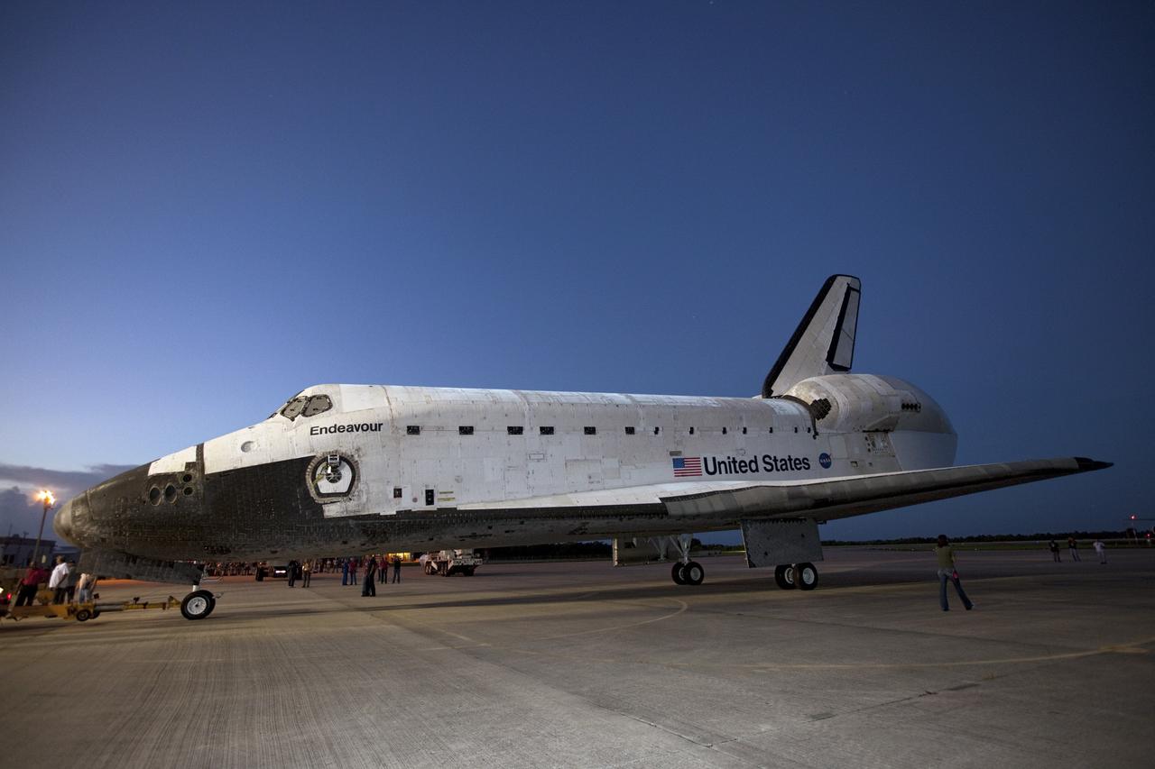 CAPE CANAVERAL, Fla. – Space shuttle Endeavour arrives at the Shuttle Landing Facility after the shuttle was towed from the Vehicle Assembly Building at NASA's Kennedy Space Center in Florida. Endeavour was towed to the Mate-Demate Device, or MDD, where the shuttle will be lifted and connected to the top of NASA's Shuttle Carrier Aircraft SCA, a modified 747 jetliner. The shuttle has been fitted with an aerodynamic tailcone for its flight aboard the SCA to Los Angeles where it will be placed on public display. Photo credit: NASA/Kim Shiflett