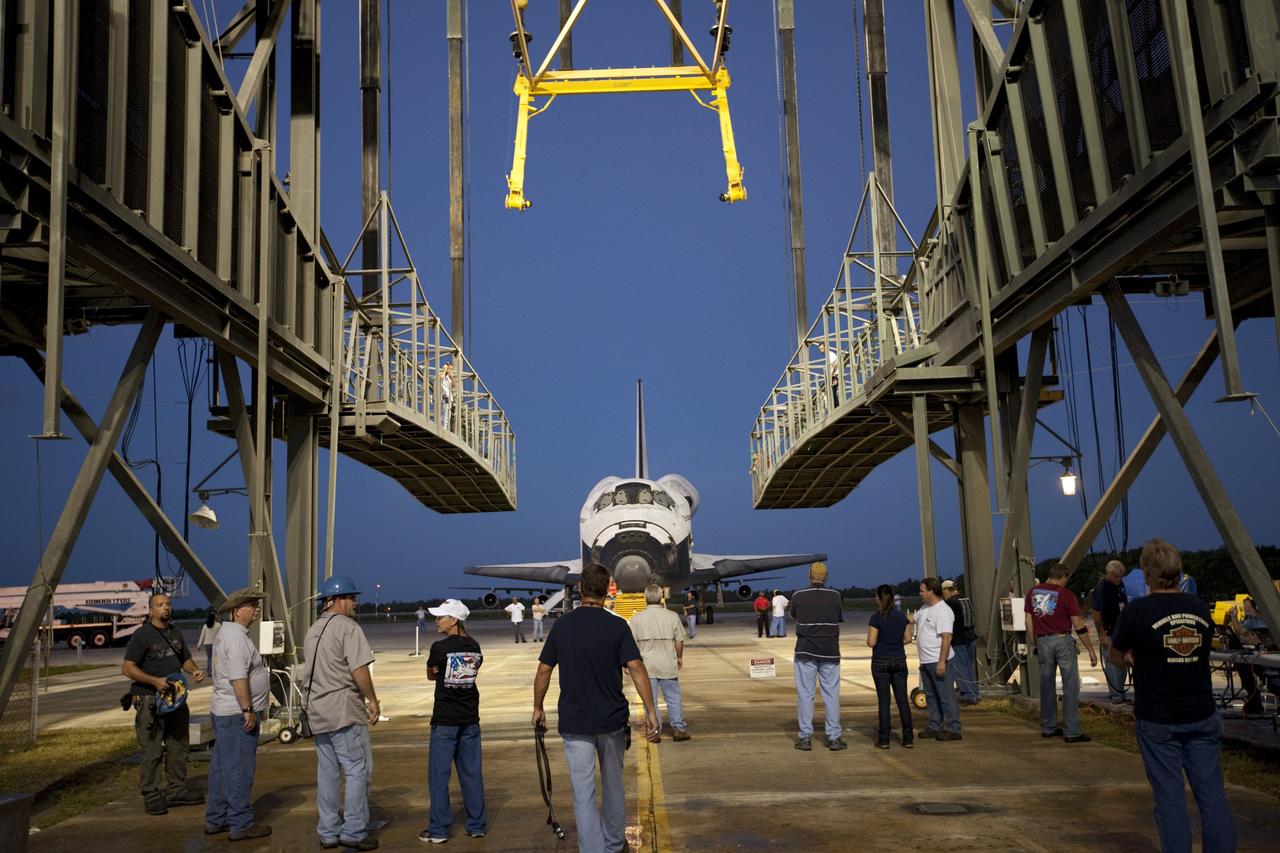 CAPE CANAVERAL, Fla. – Space shuttle Endeavour is towed into the Mate-Demate Device, or MDD, at NASA's Kennedy Space Center in Florida. The MDD will be used to lift and connect the shuttle to the top of NASA's Shuttle Carrier Aircraft SCA, a modified 747 jetliner. The shuttle has been fitted with an aerodynamic tailcone for its flight aboard the SCA to Los Angeles where it will be placed on public display. The shuttle was towed from the Vehicle Assembly Building. Photo credit: NASA/Kim Shiflett
