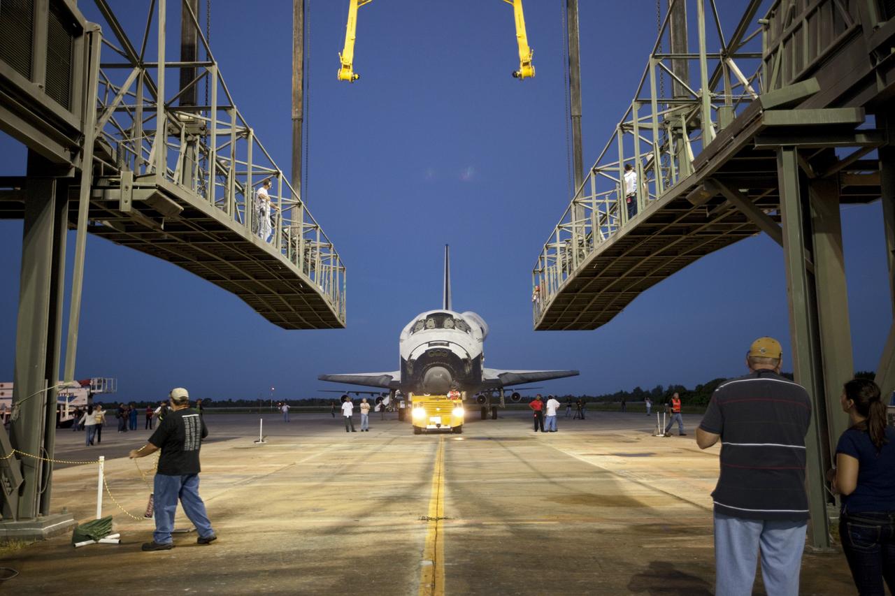 CAPE CANAVERAL, Fla. – Space shuttle Endeavour is towed into the Mate-Demate Device, or MDD, at NASA's Kennedy Space Center in Florida. The MDD will be used to lift and connect the shuttle to the top of NASA's Shuttle Carrier Aircraft SCA, a modified 747 jetliner. The shuttle has been fitted with an aerodynamic tailcone for its flight aboard the SCA to Los Angeles where it will be placed on public display. The shuttle was towed from the Vehicle Assembly Building. Photo credit: NASA/Kim Shiflett