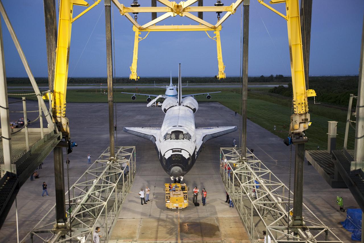 CAPE CANAVERAL, Fla. – Space shuttle Endeavour is towed into the Mate-Demate Device, or MDD, at NASA's Kennedy Space Center in Florida. The MDD will be used to lift and connect the shuttle to the top of NASA's Shuttle Carrier Aircraft SCA, a modified 747 jetliner. The shuttle has been fitted with an aerodynamic tailcone for its flight aboard the SCA to Los Angeles where it will be placed on public display. The shuttle was towed from the Vehicle Assembly Building. Photo credit: NASA/Kim Shiflett