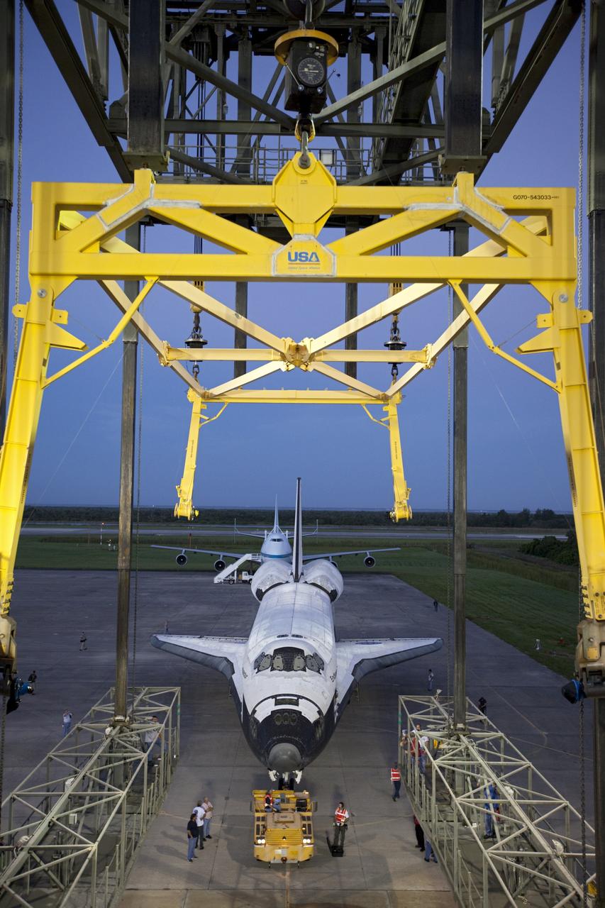 CAPE CANAVERAL, Fla. – Space shuttle Endeavour is towed into the Mate-Demate Device, or MDD, at NASA's Kennedy Space Center in Florida. The MDD will be used to lift and connect the shuttle to the top of NASA's Shuttle Carrier Aircraft SCA, a modified 747 jetliner. The shuttle has been fitted with an aerodynamic tailcone for its flight aboard the SCA to Los Angeles where it will be placed on public display. The shuttle was towed from the Vehicle Assembly Building. Photo credit: NASA/Kim Shiflett