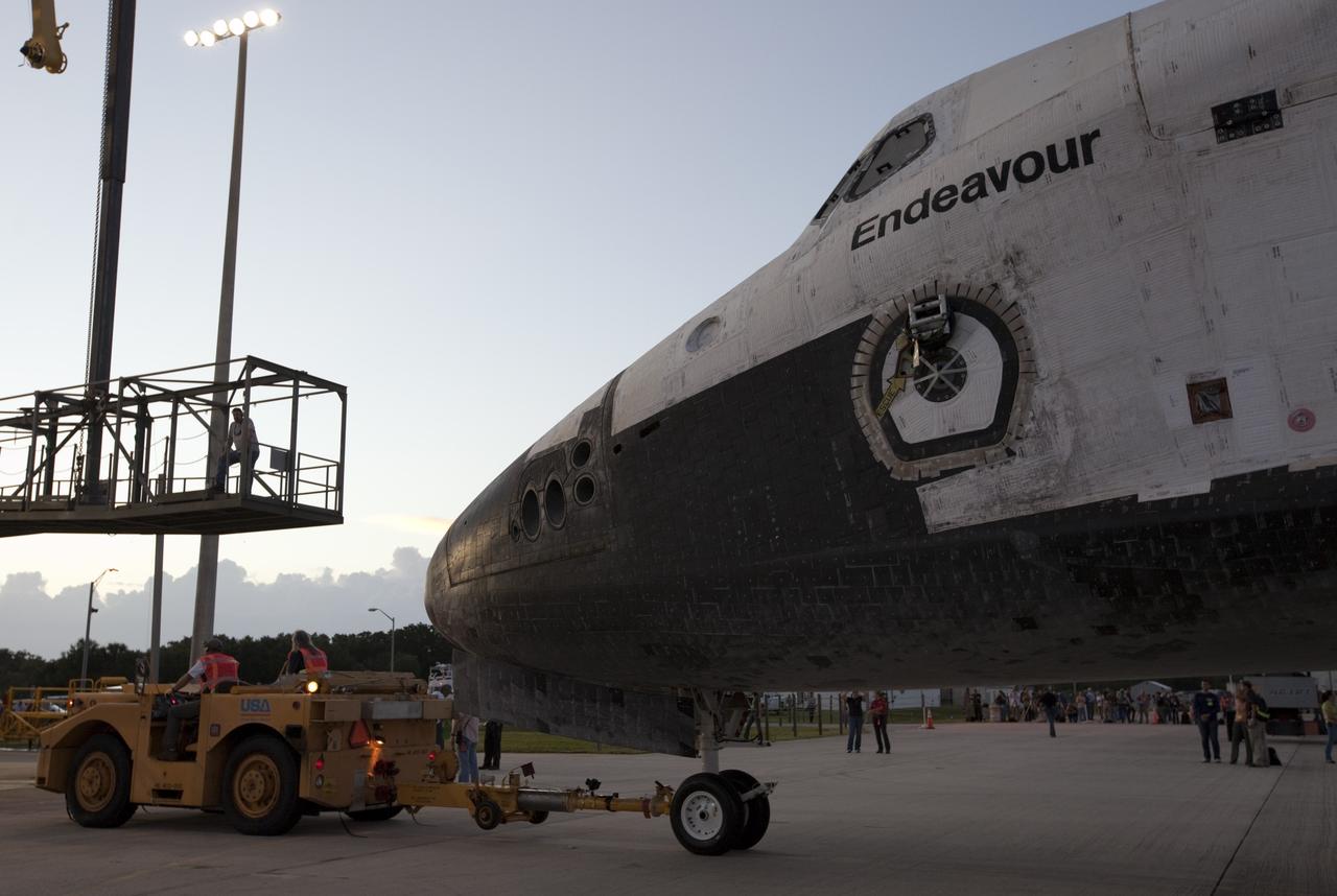 CAPE CANAVERAL, Fla. – Space shuttle Endeavour is towed into the Mate-Demate Device, or MDD, at NASA's Kennedy Space Center in Florida. The MDD will be used to lift and connect the shuttle to the top of NASA's Shuttle Carrier Aircraft SCA, a modified 747 jetliner. The shuttle has been fitted with an aerodynamic tailcone for its flight aboard the SCA to Los Angeles where it will be placed on public display. The shuttle was towed from the Vehicle Assembly Building. Photo credit: NASA/Kim Shiflett