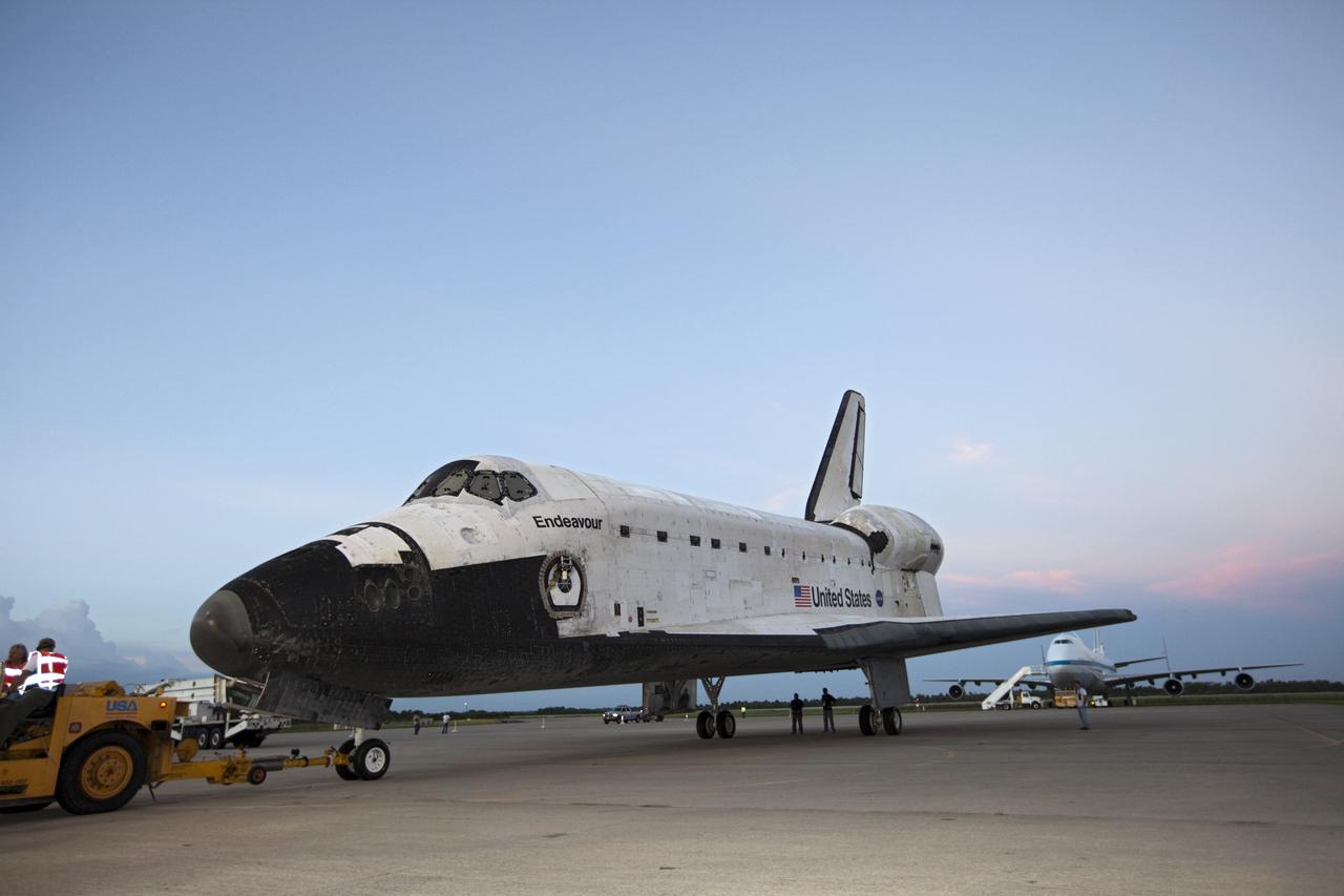 CAPE CANAVERAL, Fla. – Space shuttle Endeavour is towed into the Mate-Demate Device, or MDD, at NASA's Kennedy Space Center in Florida. The MDD will be used to lift and connect the shuttle to the top of NASA's Shuttle Carrier Aircraft SCA, a modified 747 jetliner. The shuttle has been fitted with an aerodynamic tailcone for its flight aboard the SCA to Los Angeles where it will be placed on public display. The shuttle was towed from the Vehicle Assembly Building. Photo credit: NASA/Kim Shiflett