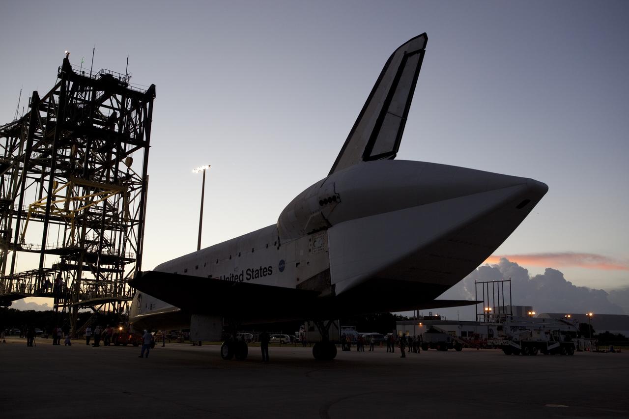 CAPE CANAVERAL, Fla. - Space shuttle Endeavour is towed to the Mate-Demate Device, or MDD, at NASA's Kennedy Space Center in Florida after being backed out of the Vehicle Assembly Building. The MDD is located at the Shuttle Landing Facility at Kennedy. The shuttle will be lifted and connected to the top of NASA's Shuttle Carrier Aircraft SCA, a modified 747 jetliner. The shuttle has been fitted with an aerodynamic tailcone for its flight aboard the SCA to Los Angeles where it will be placed on public display. Photo credit: NASA/Dmitri Gerondidakis