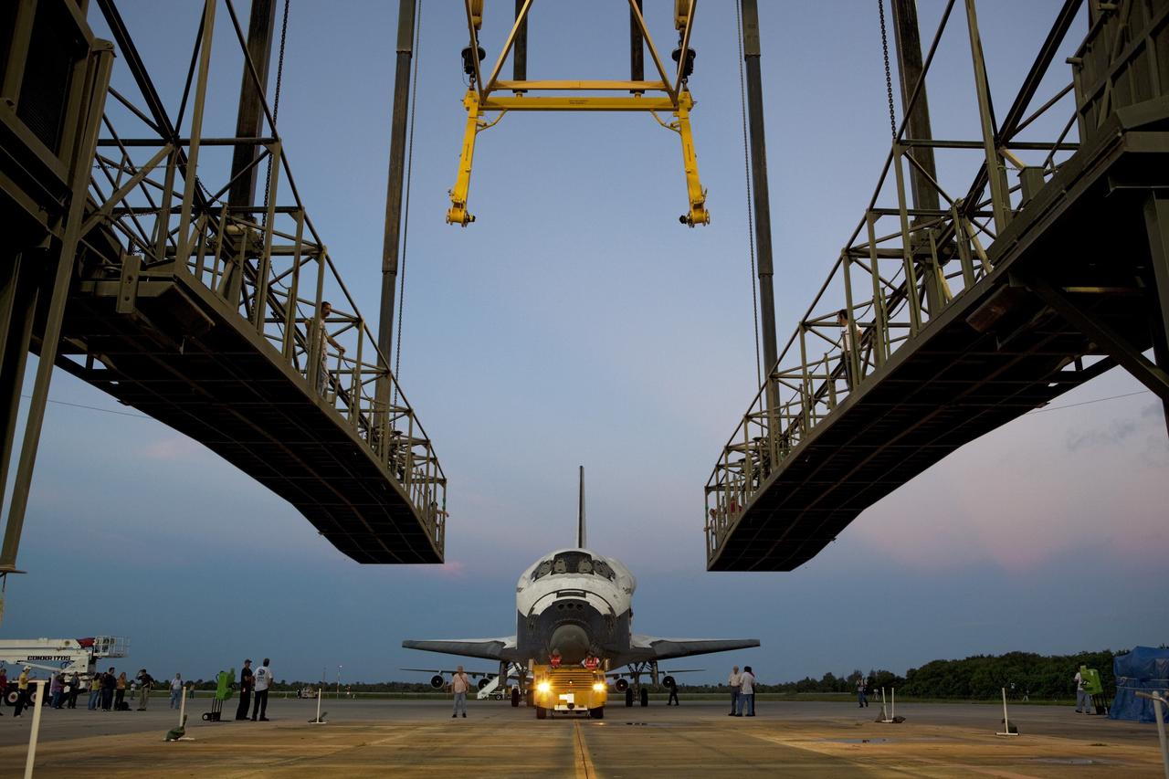 CAPE CANAVERAL, Fla. - Space shuttle Endeavour is towed into the Mate-Demate Device, or MDD, at NASA's Kennedy Space Center in Florida after being backed out of the Vehicle Assembly Building. The MDD is located at the Shuttle Landing Facility at Kennedy. The shuttle will be lifted and connected to the top of NASA's Shuttle Carrier Aircraft SCA, a modified 747 jetliner. The shuttle has been fitted with an aerodynamic tailcone for its flight aboard the SCA to Los Angeles where it will be placed on public display. Photo credit: NASA/Dmitri Gerondidakis