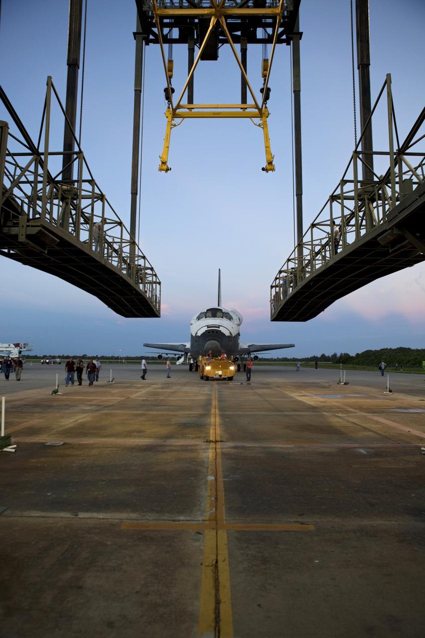 CAPE CANAVERAL, Fla. - Space shuttle Endeavour is towed into the Mate-Demate Device, or MDD, at NASA's Kennedy Space Center in Florida after being backed out of the Vehicle Assembly Building. The MDD is located at the Shuttle Landing Facility at Kennedy. The shuttle will be lifted and connected to the top of NASA's Shuttle Carrier Aircraft SCA, a modified 747 jetliner. The shuttle has been fitted with an aerodynamic tailcone for its flight aboard the SCA to Los Angeles where it will be placed on public display. Photo credit: NASA/Dmitri Gerondidakis