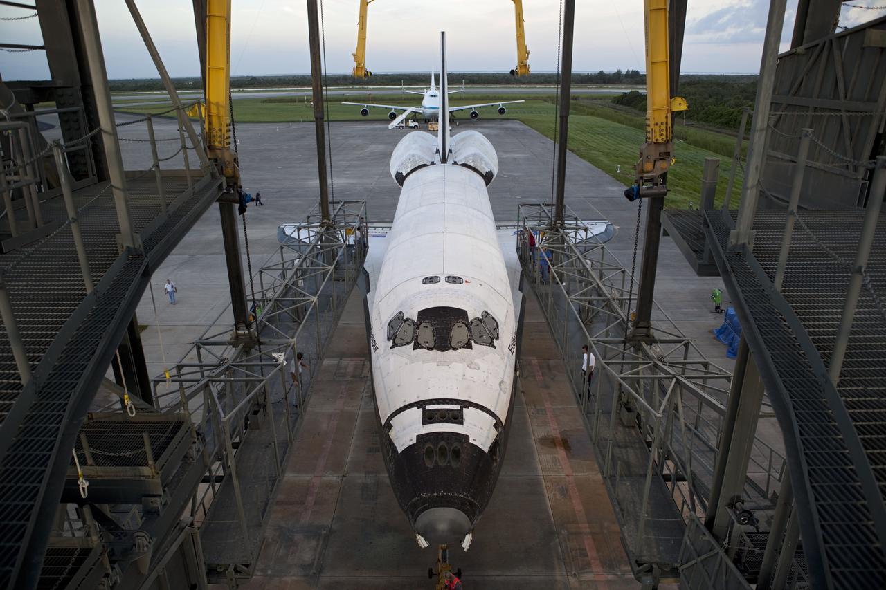 CAPE CANAVERAL, Fla. - Space shuttle Endeavour is towed into the Mate-Demate Device, or MDD, at NASA's Kennedy Space Center in Florida after being backed out of the Vehicle Assembly Building. The MDD is located at the Shuttle Landing Facility at Kennedy. The shuttle will be lifted and connected to the top of NASA's Shuttle Carrier Aircraft SCA, a modified 747 jetliner. The shuttle has been fitted with an aerodynamic tailcone for its flight aboard the SCA to Los Angeles where it will be placed on public display. Photo credit: NASA/Dmitri Gerondidakis