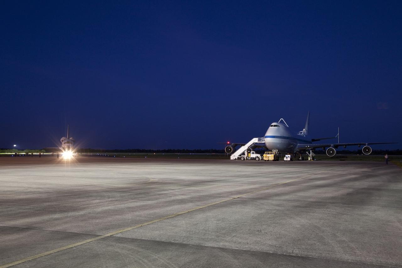 CAPE CANAVERAL, Fla. – The Shuttle Carrier Aircraft, or SCA, is seen at the ramp area of the Shuttle Landing Facility at NASA's Kennedy Space Center in Florida as it space shuttle Endeavour arrives. The SCA, a modified 747 jetliner, will fly Endeavour to Los Angeles where it will be placed on public display.  Photo credit: NASA/Frankie Martin