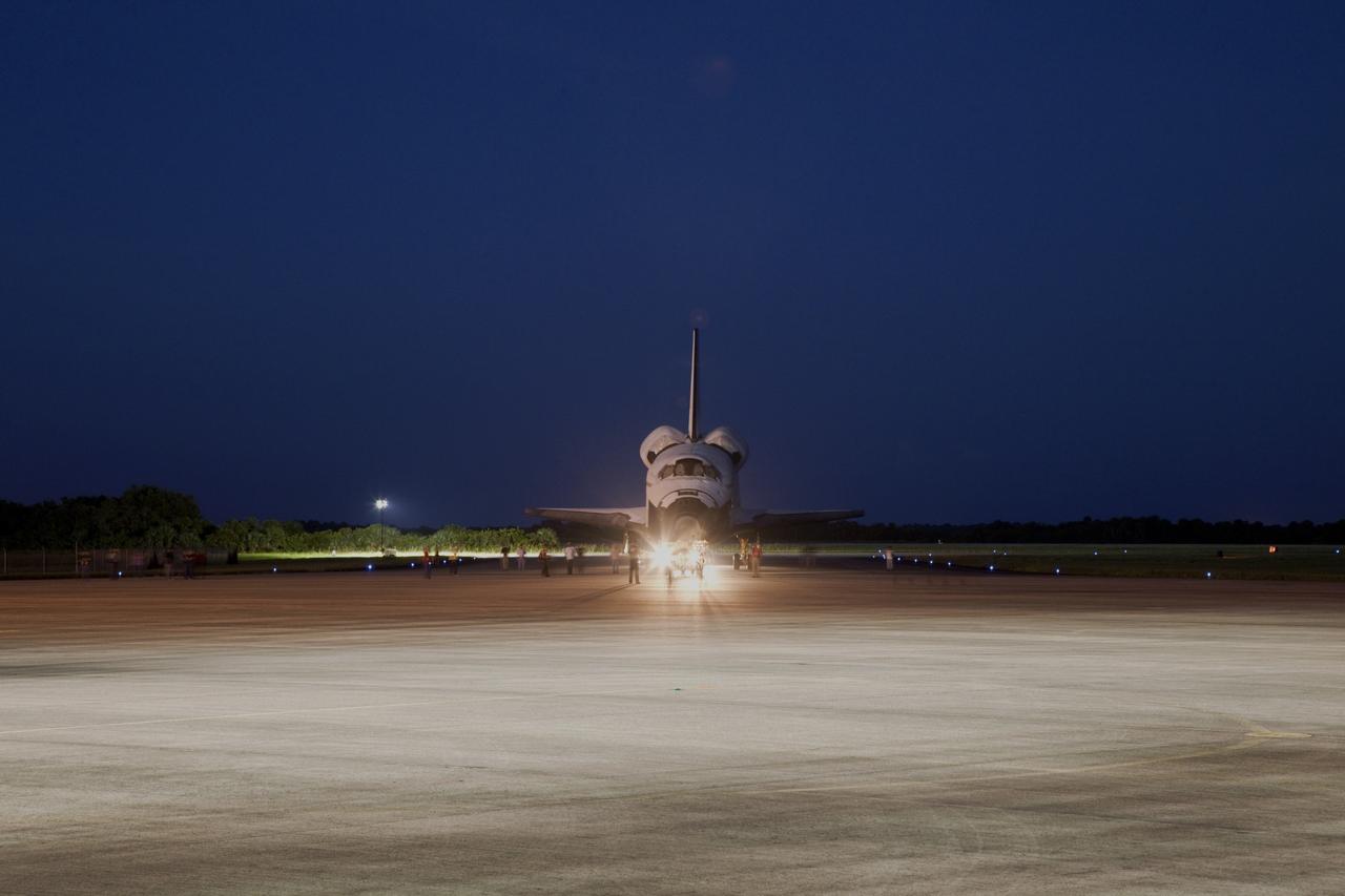 CAPE CANAVERAL, Fla. – Space shuttle Endeavour is towed to the Mate-Demate Device, or MDD, at NASA's Kennedy Space Center in Florida after being backed out of the Vehicle Assembly Building. The MDD is located at the Shuttle Landing Facility at Kennedy. The shuttle will be lifted and connected to the top of NASA's Shuttle Carrier Aircraft SCA, a modified 747 jetliner. The shuttle has been fitted with an aerodynamic tailcone for its flight aboard the SCA to Los Angeles where it will be placed on public display. Photo credit: NASA/Kim Shiflett
