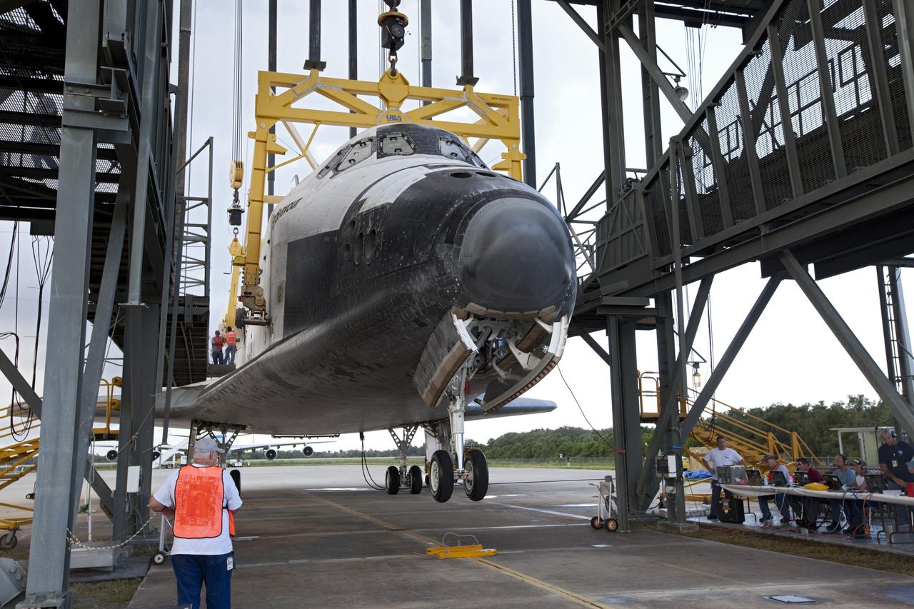CAPE CANAVERAL, Fla. – The nose landing gear of space shuttle Endeavour is lifted during operations to raise the shuttle for securing to the Shuttle Carrier Aircraft, or SCA. The shuttle is inside the Mate-Demate Device, or MDD, at the Shuttle Landing Facility at NASA's Kennedy Space Center in Florida. The SCA will carry Endeavour to Los Angeles where it will be placed on public display. Photo credit: NASA/Kim Shiflett
