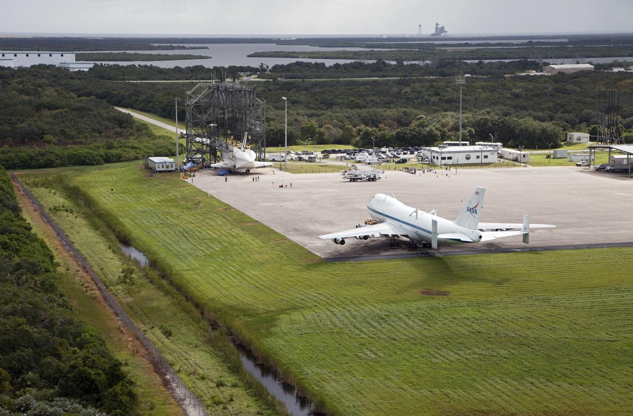 CAPE CANAVERAL, Fla. – Space shuttle Endeavour is seen inside the Mate-Demate Device, or MDD, at the Shuttle Landing Facility at NASA's Kennedy Space Center in Florida. The Shuttle Carrier Aircraft, or SCA, is at the lower edge of the ramp. The SCA will carry Endeavour to Los Angeles where it will be placed on public display. Photo credit: NASA/Kim Shiflett