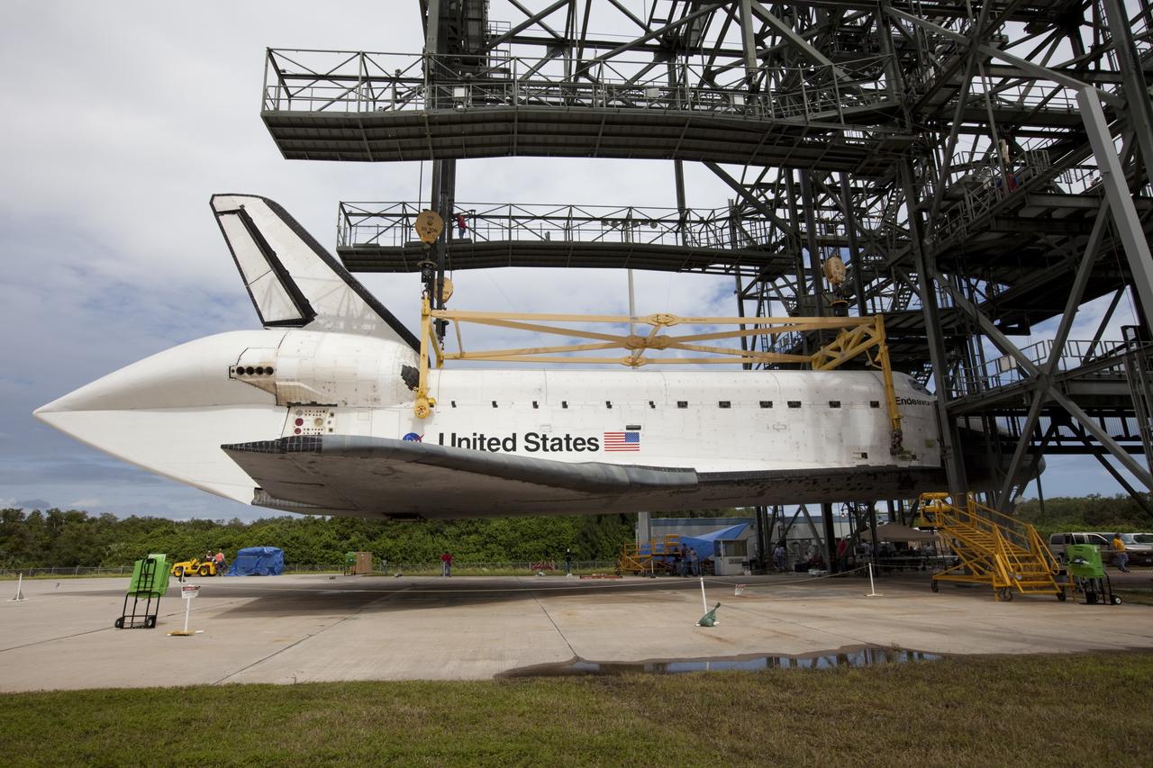CAPE CANAVERAL, Fla. – Space shuttle Endeavour hovers above the ground as it is lifted into the mate-demate device at the Shuttle Landing Facility at NASA's Kennedy Space Center in Florida. The shuttle will be positioned and connected to the top of NASA's Shuttle Carrier Aircraft, or SCA, with the aid of the device. The shuttle has been fitted with an aerodynamic tailcone for its upcoming ferry flight. The SCA, a modified 747 jetliner, will fly Endeavour to Los Angeles where it will be placed on public display at the California Science Center. This is the final ferry flight scheduled in the Space Shuttle Program era. For more information on the shuttles' transition and retirement, visit http://www.nasa.gov/transition. Photo credit: NASA/Kim Shiflett