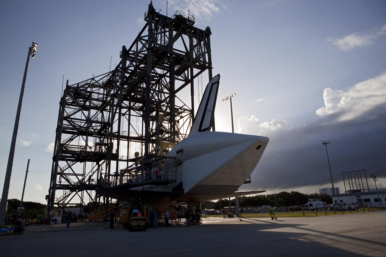 CAPE CANAVERAL, Fla. – Preparations are under way to lift space shuttle Endeavour into the mate-demate device as the sun rises over the Shuttle Landing Facility at NASA's Kennedy Space Center in Florida. The shuttle will be positioned and connected to the top of NASA's Shuttle Carrier Aircraft with the aid of the device. The shuttle has been fitted with an aerodynamic tailcone for its upcoming ferry flight. The SCA, a modified 747 jetliner, will fly Endeavour to Los Angeles where it will be placed on public display at the California Science Center. This is the final ferry flight scheduled in the Space Shuttle Program era. For more information on the shuttles' transition and retirement, visit http://www.nasa.gov/transition. Photo credit: NASA/Dimitri Gerondidakis