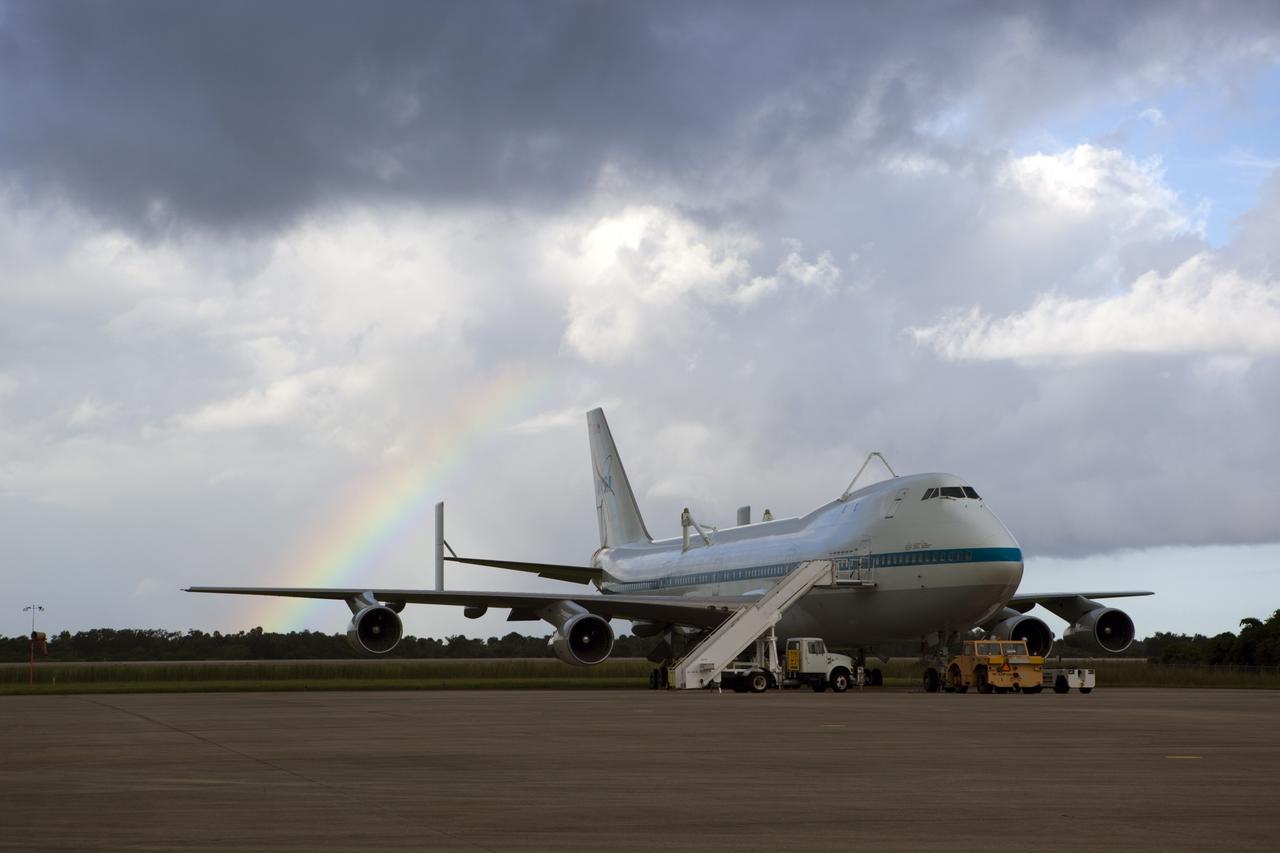 CAPE CANAVERAL, Fla. – A rainbow forms behind NASA's Shuttle Carrier Aircraft, or SCA, at the Shuttle Landing Facility at NASA's Kennedy Space Center in Florida. Operations are under way to position space shuttle Endeavour atop the SCA for its upcoming ferry flight.    The SCA, a modified 747 jetliner, will fly Endeavour to Los Angeles where it will be placed on public display at the California Science Center. This is the final ferry flight scheduled in the Space Shuttle Program era. For more information on the shuttles' transition and retirement, visit http://www.nasa.gov/transition.  Photo credit: NASA/Dimitri Gerondidakis