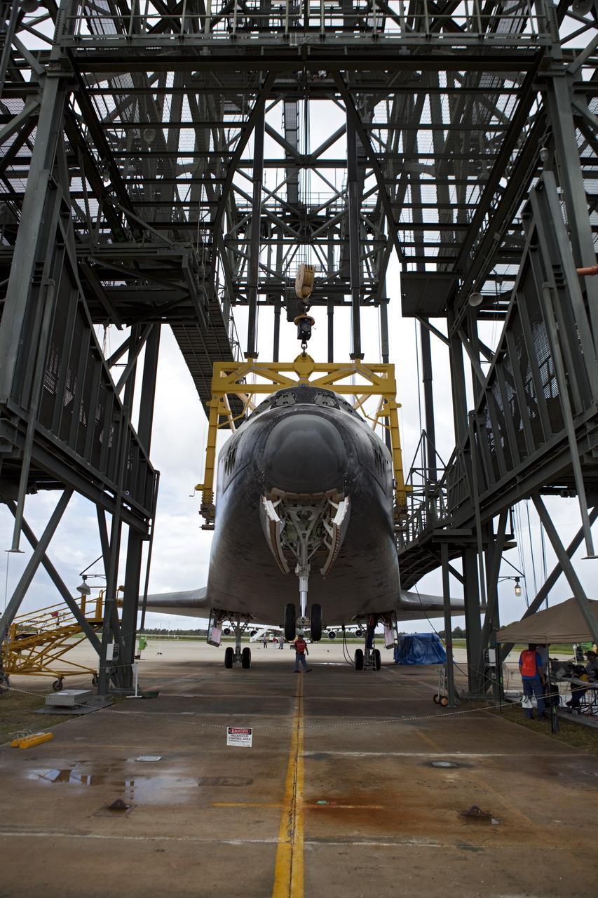 CAPE CANAVERAL, Fla. – Space shuttle Endeavour is lifted into the mate-demate device at the Shuttle Landing Facility at NASA's Kennedy Space Center in Florida. The shuttle will be positioned and connected to the top of NASA's Shuttle Carrier Aircraft with the aid of the device. The SCA, a modified 747 jetliner, will fly Endeavour to Los Angeles where it will be placed on public display at the California Science Center. This is the final ferry flight scheduled in the Space Shuttle Program era. For more information on the shuttles' transition and retirement, visit http://www.nasa.gov/transition. Photo credit: NASA/Dimitri Gerondidakis
