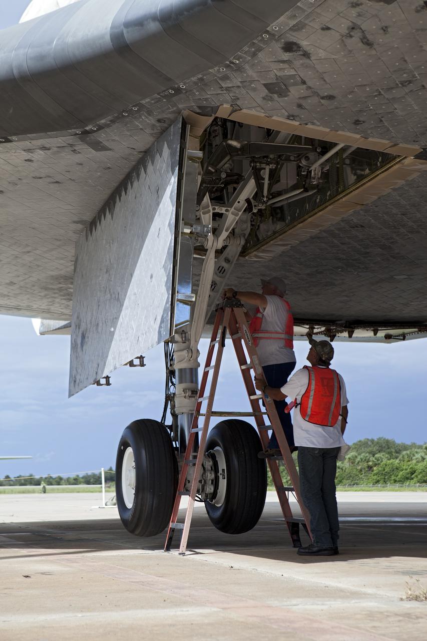 CAPE CANAVERAL, Fla. – United Space Alliance technicians retract the landing gear on space shuttle Endeavour. The shuttle is being lifted into the mate-demate device at the Shuttle Landing Facility at NASA's Kennedy Space Center in Florida. Endeavour will be positioned and connected to the top of NASA's Shuttle Carrier Aircraft with the aid of the device. The SCA, a modified 747 jetliner, will fly Endeavour to Los Angeles where it will be placed on public display at the California Science Center. This is the final ferry flight scheduled in the Space Shuttle Program era. For more information on the shuttles' transition and retirement, visit http://www.nasa.gov/transition. Photo credit: NASA/Dimitri Gerondidakis