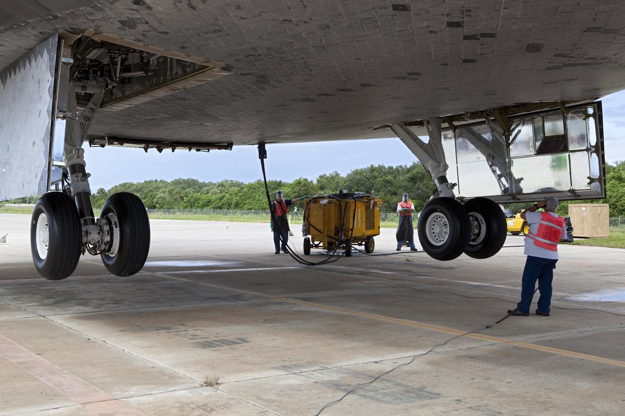CAPE CANAVERAL, Fla. – United Space Alliance technicians retract the landing gear on space shuttle Endeavour. The shuttle is being lifted into the mate-demate device at the Shuttle Landing Facility at NASA's Kennedy Space Center in Florida. Endeavour will be positioned and connected to the top of NASA's Shuttle Carrier Aircraft with the aid of the device. The SCA, a modified 747 jetliner, will fly Endeavour to Los Angeles where it will be placed on public display at the California Science Center. This is the final ferry flight scheduled in the Space Shuttle Program era. For more information on the shuttles' transition and retirement, visit http://www.nasa.gov/transition. Photo credit: NASA/Dimitri Gerondidakis