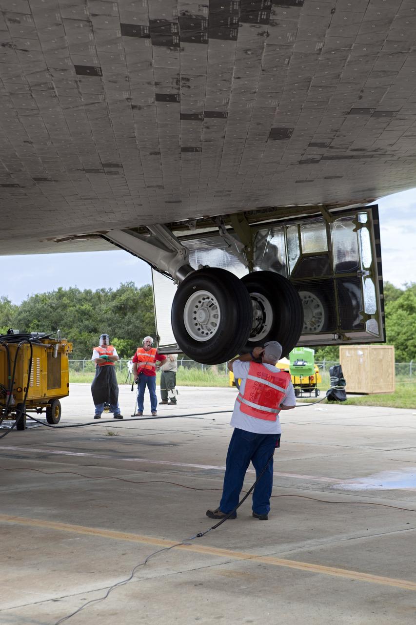 CAPE CANAVERAL, Fla. – United Space Alliance technicians retract the landing gear on space shuttle Endeavour. The shuttle is being lifted into the mate-demate device at the Shuttle Landing Facility at NASA's Kennedy Space Center in Florida. Endeavour will be positioned and connected to the top of NASA's Shuttle Carrier Aircraft with the aid of the device. The SCA, a modified 747 jetliner, will fly Endeavour to Los Angeles where it will be placed on public display at the California Science Center. This is the final ferry flight scheduled in the Space Shuttle Program era. For more information on the shuttles' transition and retirement, visit http://www.nasa.gov/transition. Photo credit: NASA/Dimitri Gerondidakis