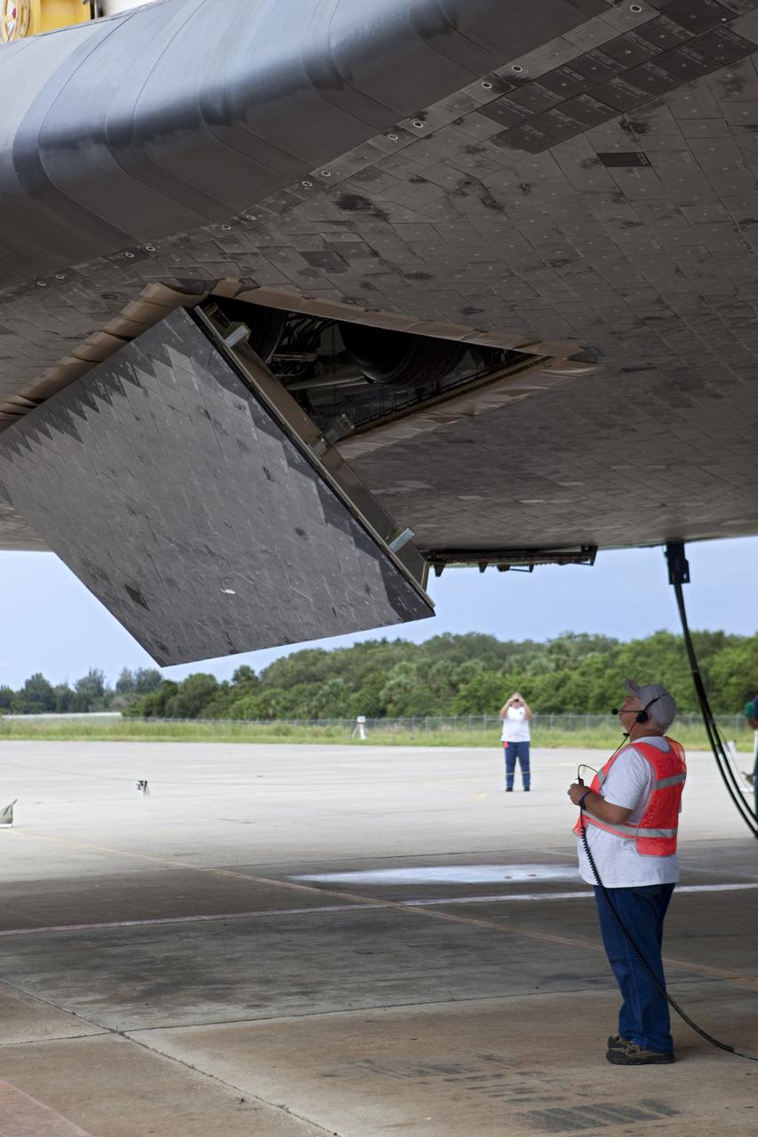 CAPE CANAVERAL, Fla. – A United Space Alliance technician retracts the landing gear on space shuttle Endeavour. The shuttle is being lifted into the mate-demate device at the Shuttle Landing Facility at NASA's Kennedy Space Center in Florida. Endeavour will be positioned and connected to the top of NASA's Shuttle Carrier Aircraft with the aid of the device. The SCA, a modified 747 jetliner, will fly Endeavour to Los Angeles where it will be placed on public display at the California Science Center. This is the final ferry flight scheduled in the Space Shuttle Program era. For more information on the shuttles' transition and retirement, visit http://www.nasa.gov/transition. Photo credit: NASA/Dimitri Gerondidakis