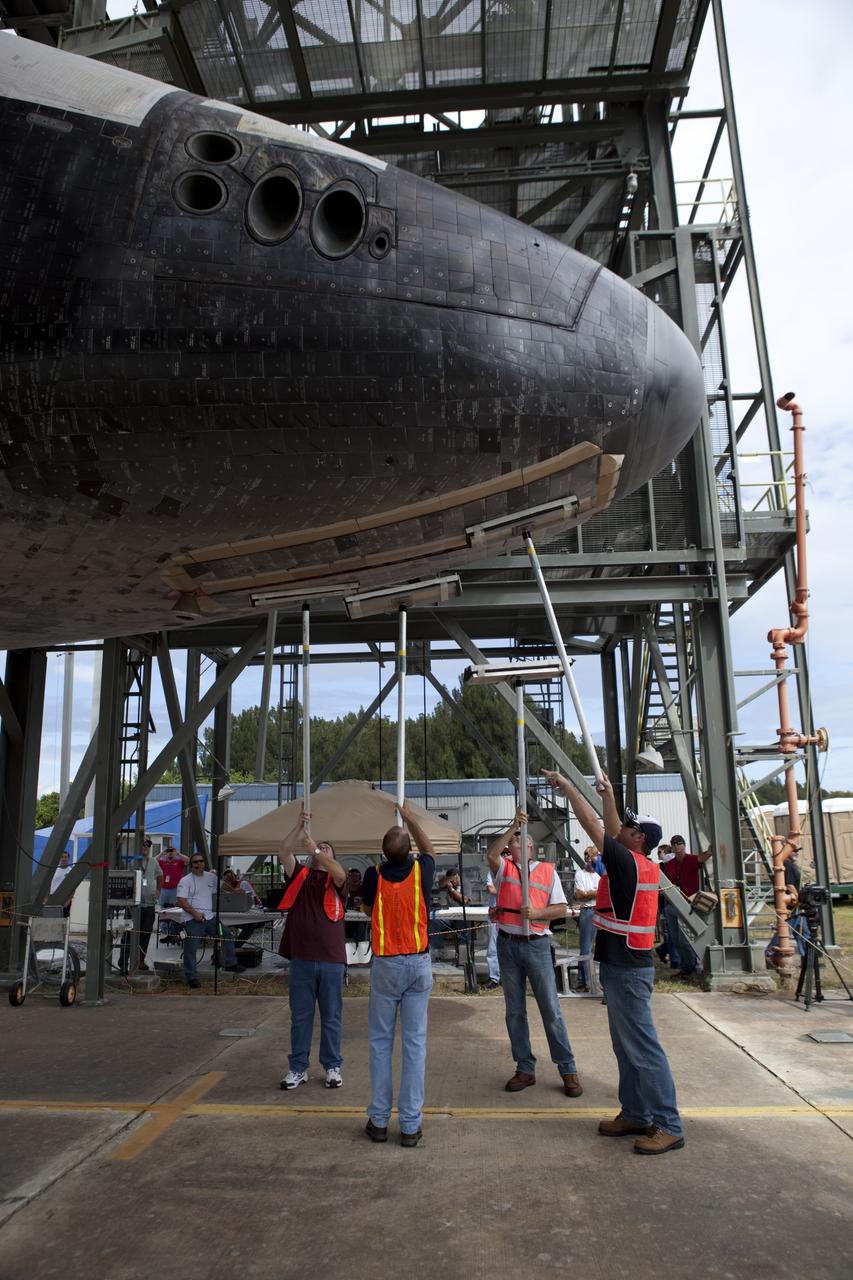 CAPE CANAVERAL, Fla. – United Space Alliance technicians manually close the doors on space shuttle Endeavour's nose gear as it is lifted into the mate-demate device at the Shuttle Landing Facility at NASA's Kennedy Space Center in Florida. The shuttle will be positioned and connected to the top of NASA's Shuttle Carrier Aircraft, or SCA, with the aid of the device. The SCA, a modified 747 jetliner, will fly Endeavour to Los Angeles where it will be placed on public display at the California Science Center. This is the final ferry flight scheduled in the Space Shuttle Program era. For more information on the shuttles' transition and retirement, visit http://www.nasa.gov/transition. Photo credit: NASA/Dimitri Gerondidakis